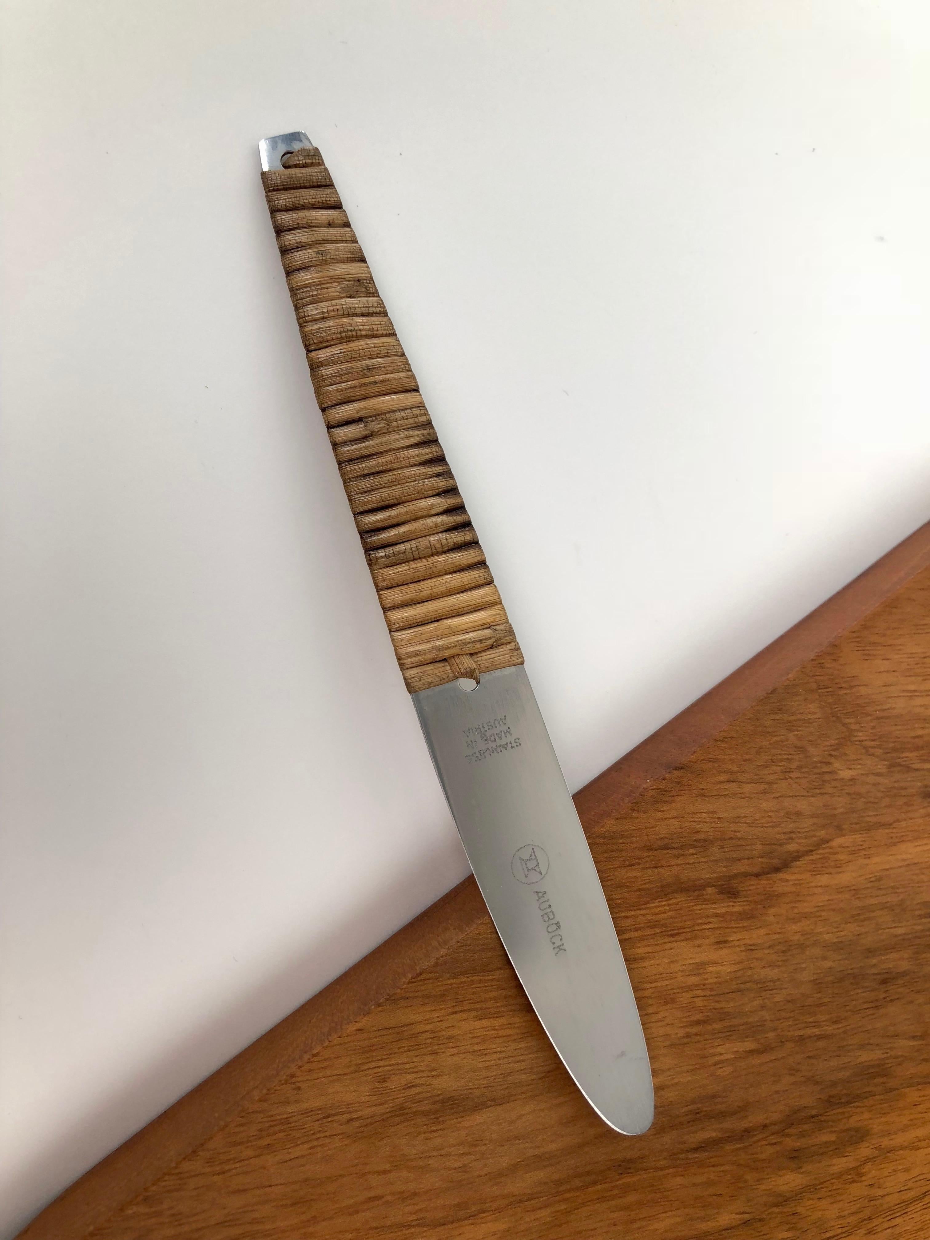 A beautiful vintage triangular cutting board and knife set, designed and made by Carl Auböck in the 1950s. The board is walnut with leather
loop that holds the knife. The knife is manufactured by Amboss Austria and is fully marked.
