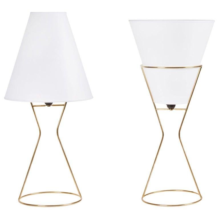 Carl Auböck vice versa table lamp. Designed in 1950, these versatile and Minimalist Viennese lamps are executed in brass with reversible paper shade by Werkstätte Carl Auböck, Austria.

Price is per item. Two lamps in stock. Out of stock lead time