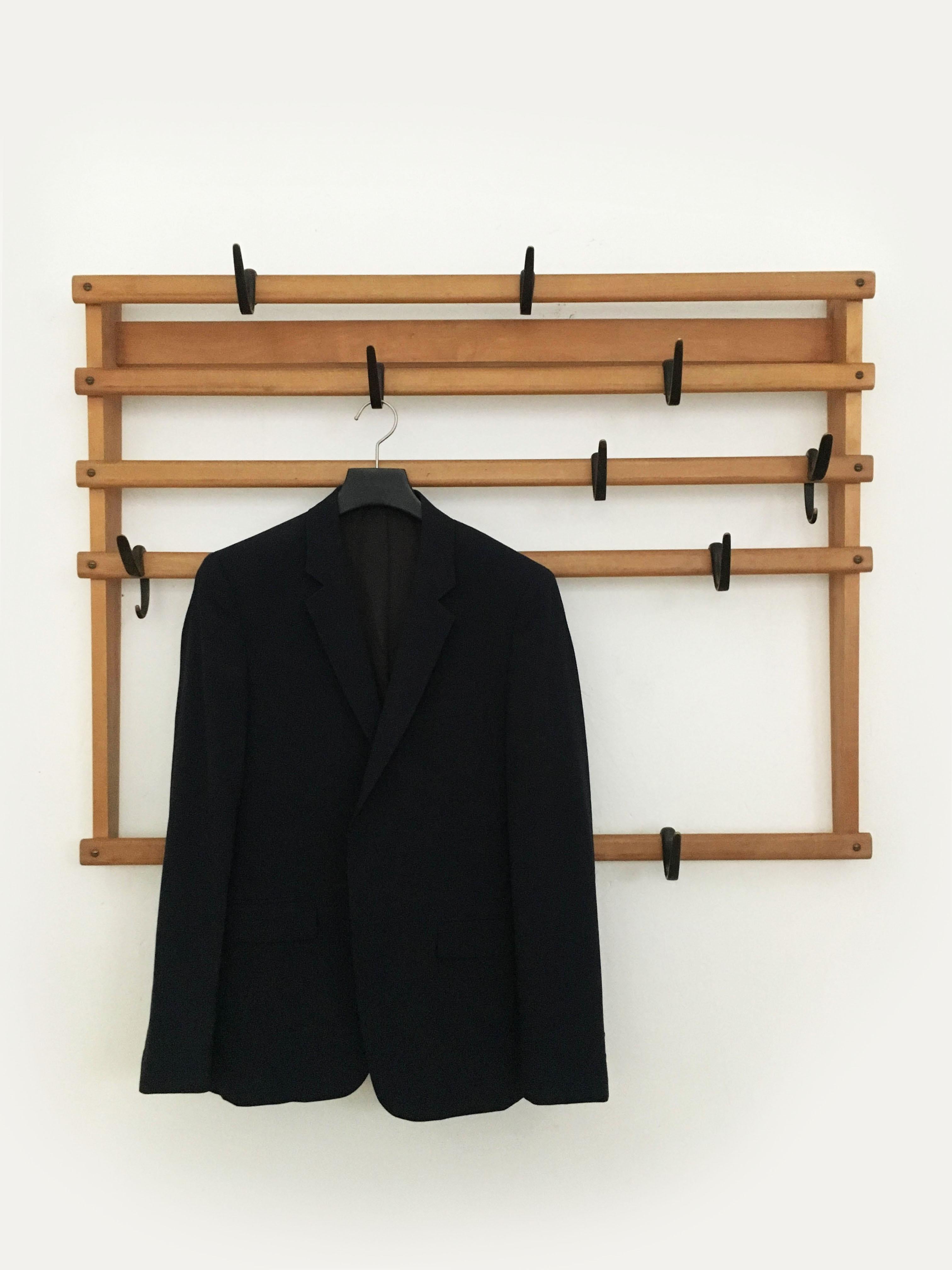 Carl Auböck wall mounted coat rack, Austria, 1950s. Comes with 9 patinated original vintage brass hooks.