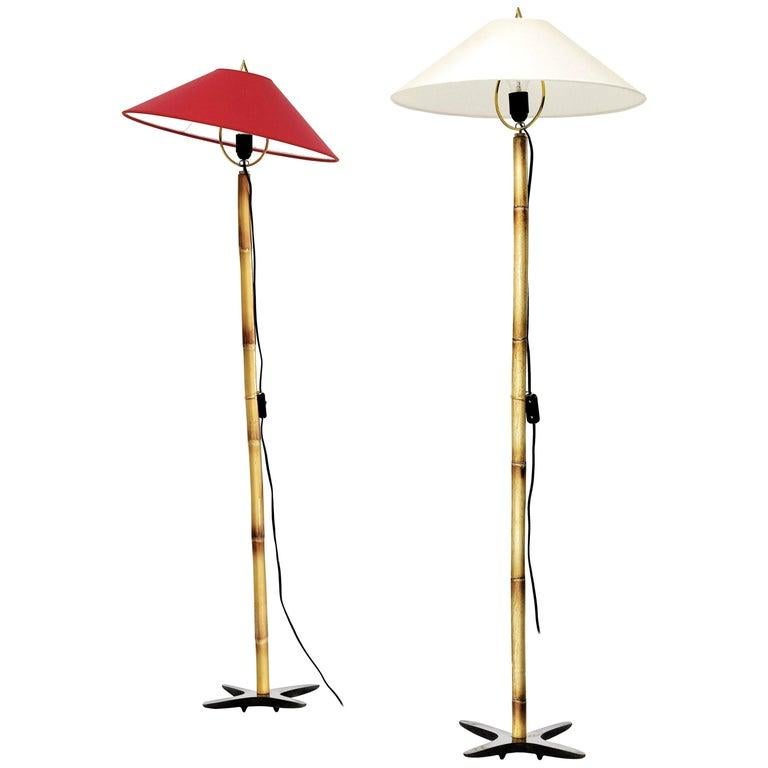 Carl Auböck X-lamp floor lamp. Designed in 1950, these versatile and Minimalist Viennese lamps are executed in bamboo and brass with a heavy X-shaped brass base that can be balanced in multiple positions. Includes sculptural hard paper shade by