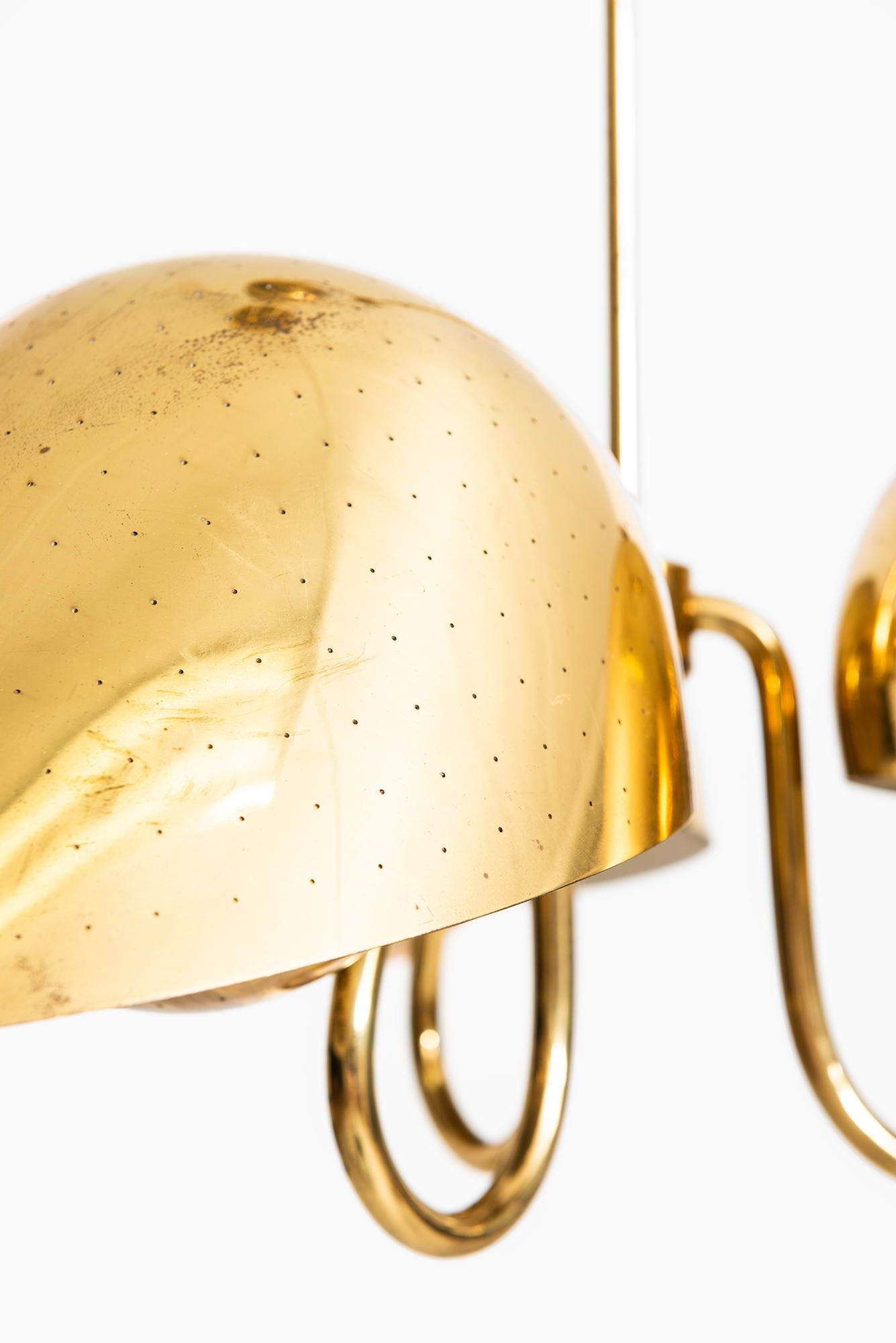 Very rare height adjustable ceiling lamp designed by Carl-Axel Acking. Produced by Bröderna Malmströms Metallvarufabrik in Sweden.