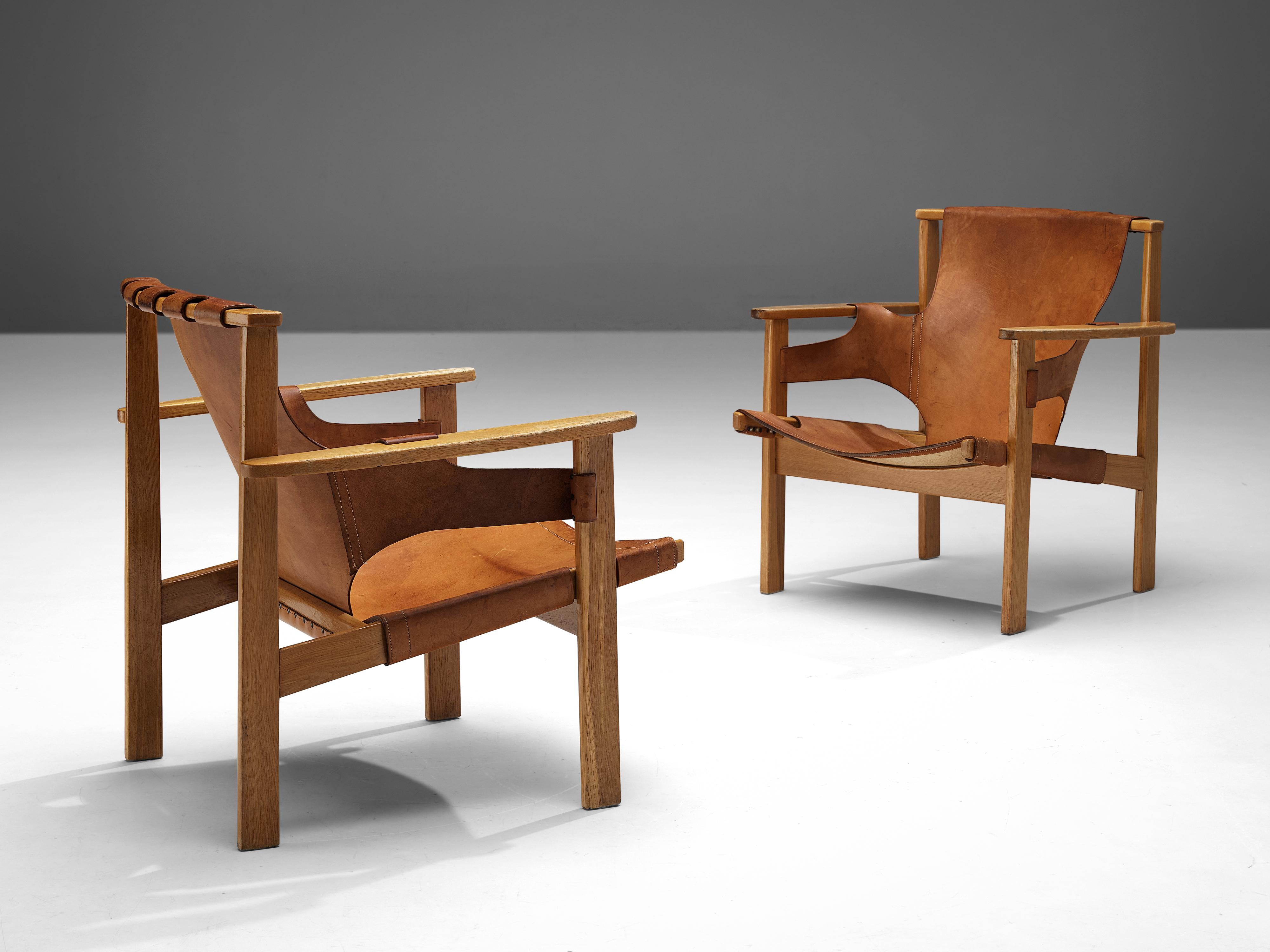 Carl-Axel Acking, pair of lounge chairs model ‘Trienna’, oak, leather, Sweden, designed in 1957

These characteristic lounge chairs were designed by the Swedish architect and furniture designer Carl-Axel Acking in 1957. The chair’s name 'Trienna'