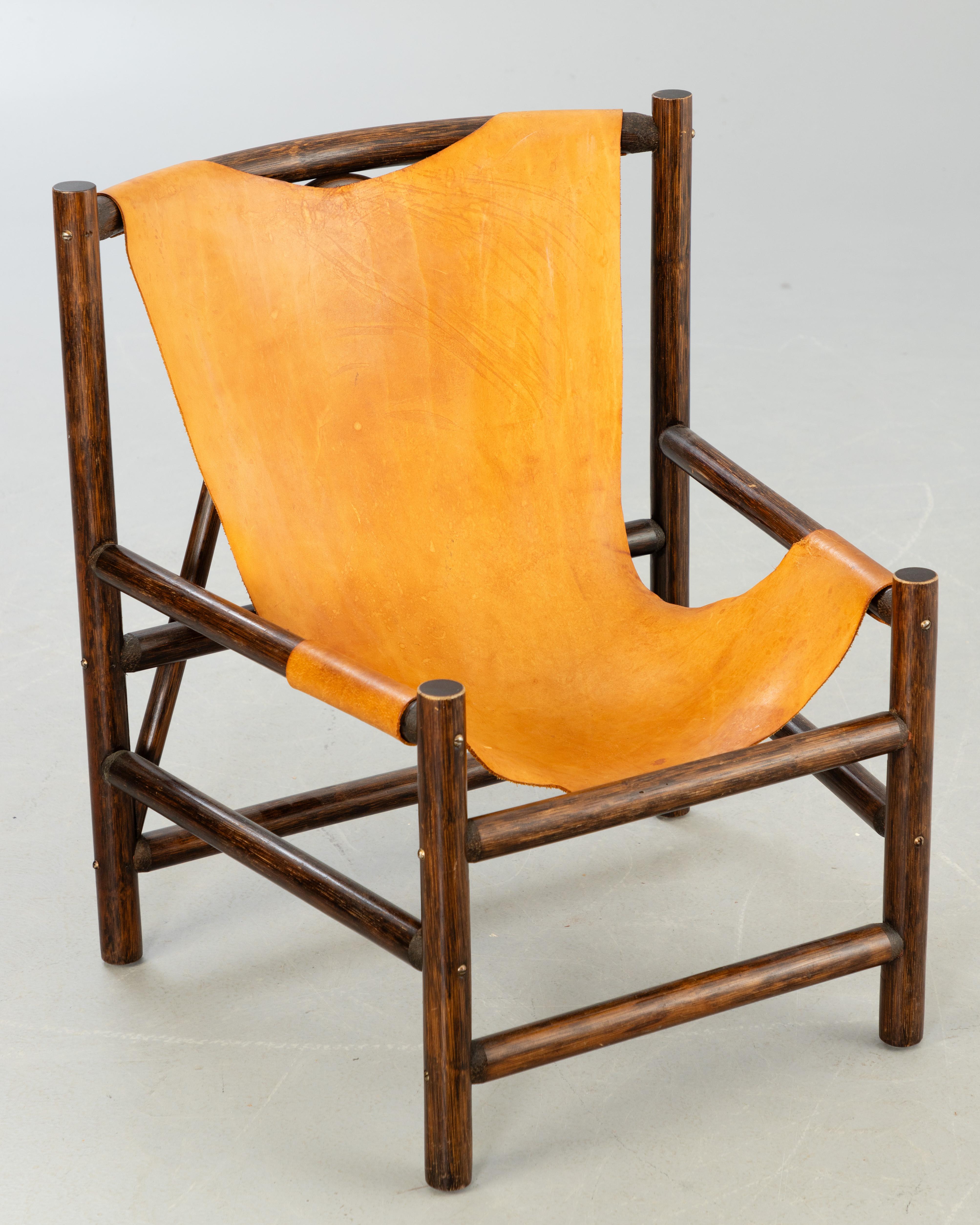 Very nice and unusual chair designed and made by unknown manufacturer, Sweden around 1960. This chair was inspired by several chairs designed by Carl-Axel Acking . This chair is made of solid wood and has a thick natural leather seat. The chair is