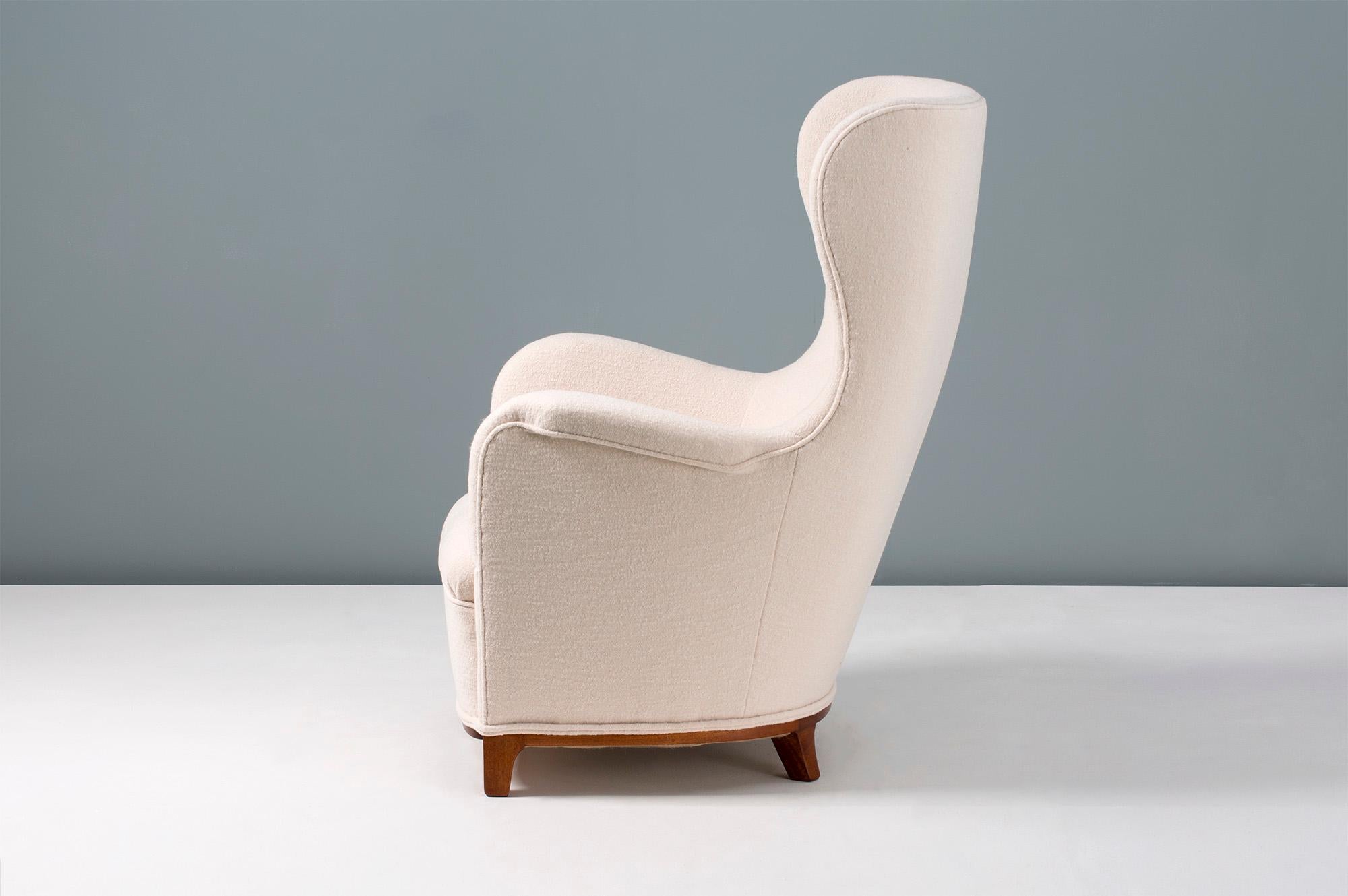 Carl-Axel Acking

Wing chair, 1940s

Rarely seen imposing wing chair from the Pioneer of the Swedish modern movement: Carl-Axel Acking. Cuban mahogany base with new luxurious, pure wool fabric upholstery.
  