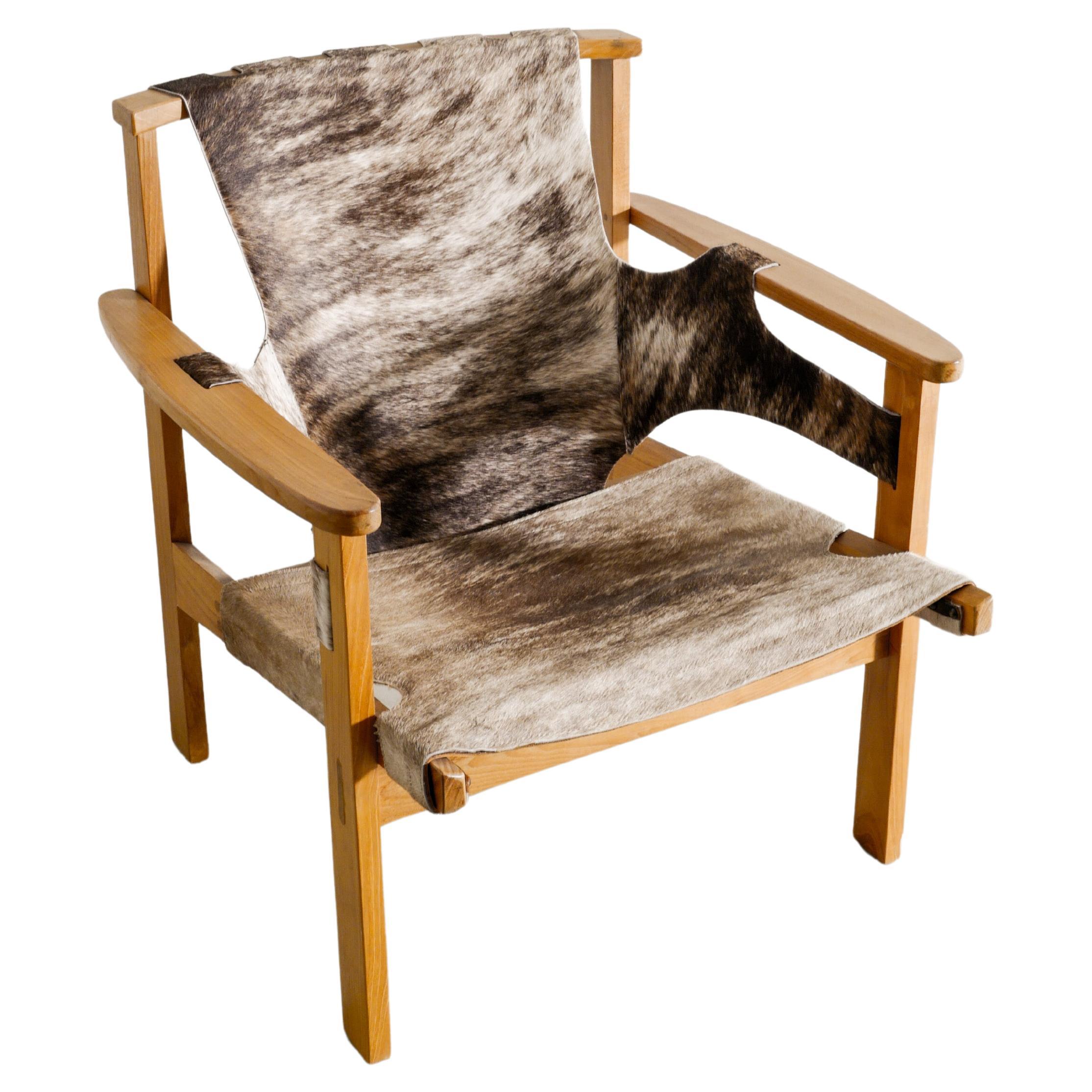 Carl-Axel Acking "Trienna" Armchair in Oak & Cow Hide Produced in Sweden, 1950s For Sale