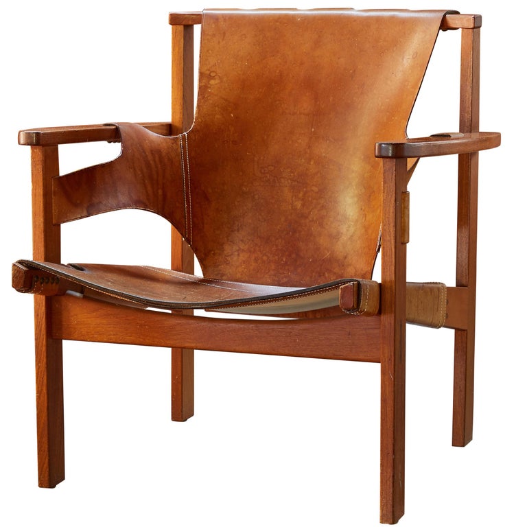 Carl-Axel Acking Trienna chair in patinated brown leather, ca. 1957, offered by Two Enlighten Los Angeles