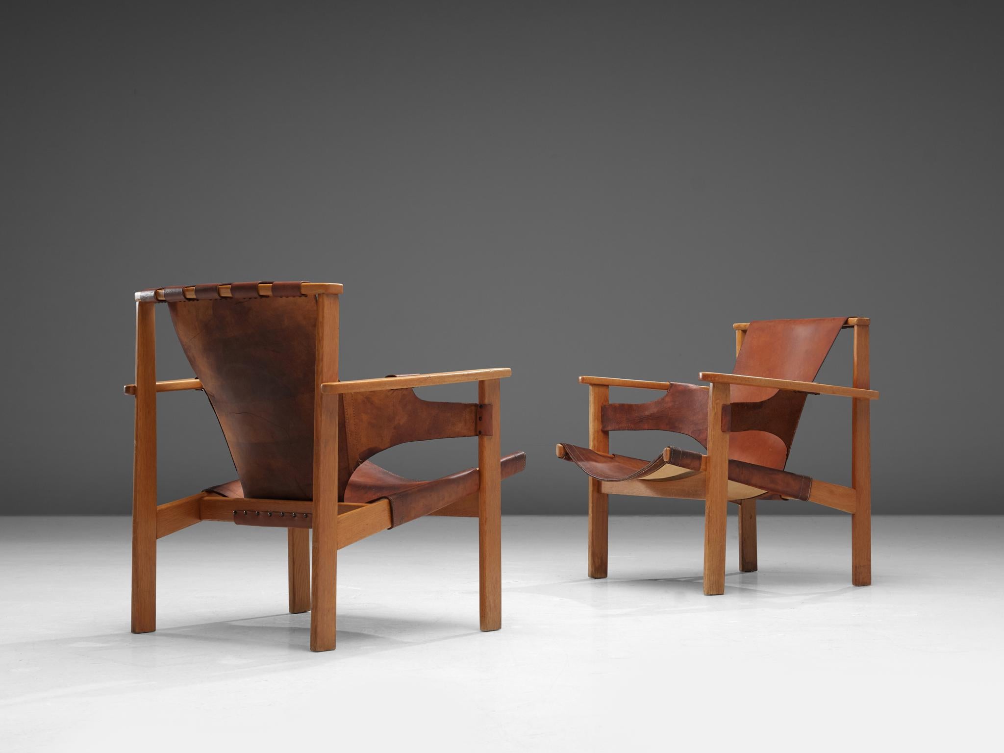 Carl-Axel Acking for NK (Nordiska Kompaniet), 'Trienna' chairs, in stained oak and leather, Sweden, 1957.

These robust chairs are designed by the Swedish architect Carl-Axel Acking and produced by Nordiska Kompaniet. The name of the chair is