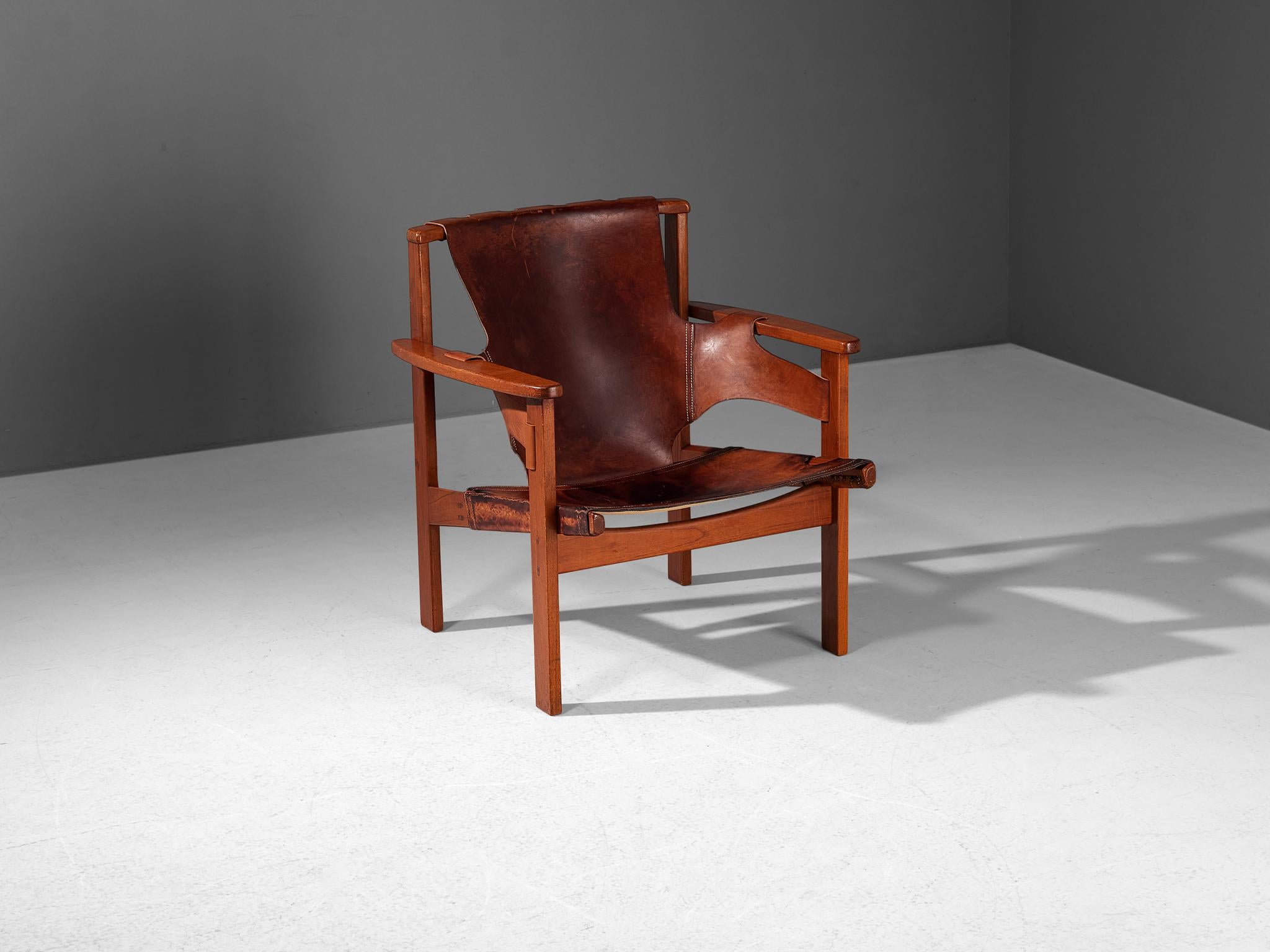 Carl-Axel Acking for Nordiska Kompaniet, lounge chair model ‘Trienna’, oak, leather, Sweden, designed in 1957

This characteristic lounge chair was designed by the Swedish architect and furniture designer Carl-Axel Acking in 1957. The chair’s name