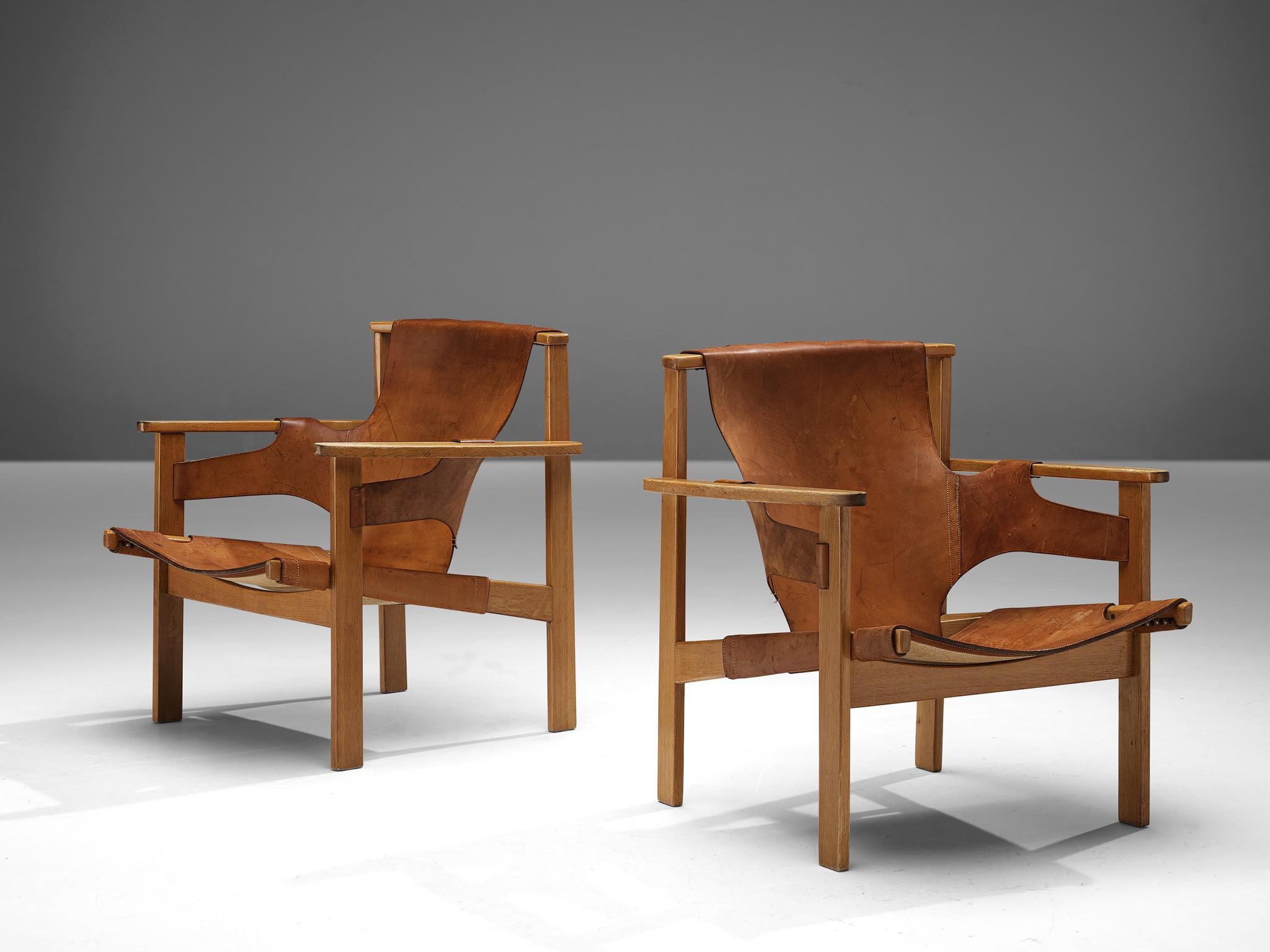 Mid-20th Century Carl-Axel Acking ‘Trienna’ Lounge Chairs in Oak and Patinated Leather For Sale