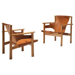 Carl-Axel Acking ‘Trienna’ Lounge Chairs in Oak and Patinated Leather