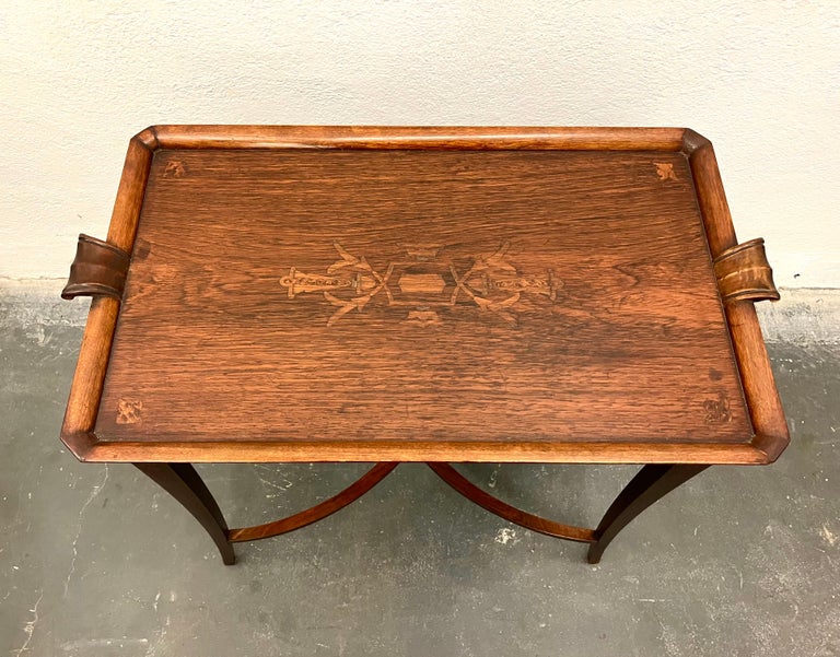 Graceful solid oak table with various inlaid wood decoration on the tray-form top. Nordiska Kompanient metal tag to underside dates the table to 1926-1927, during Bergsten's tenure as house furniture designer at the prestigious Swedish department