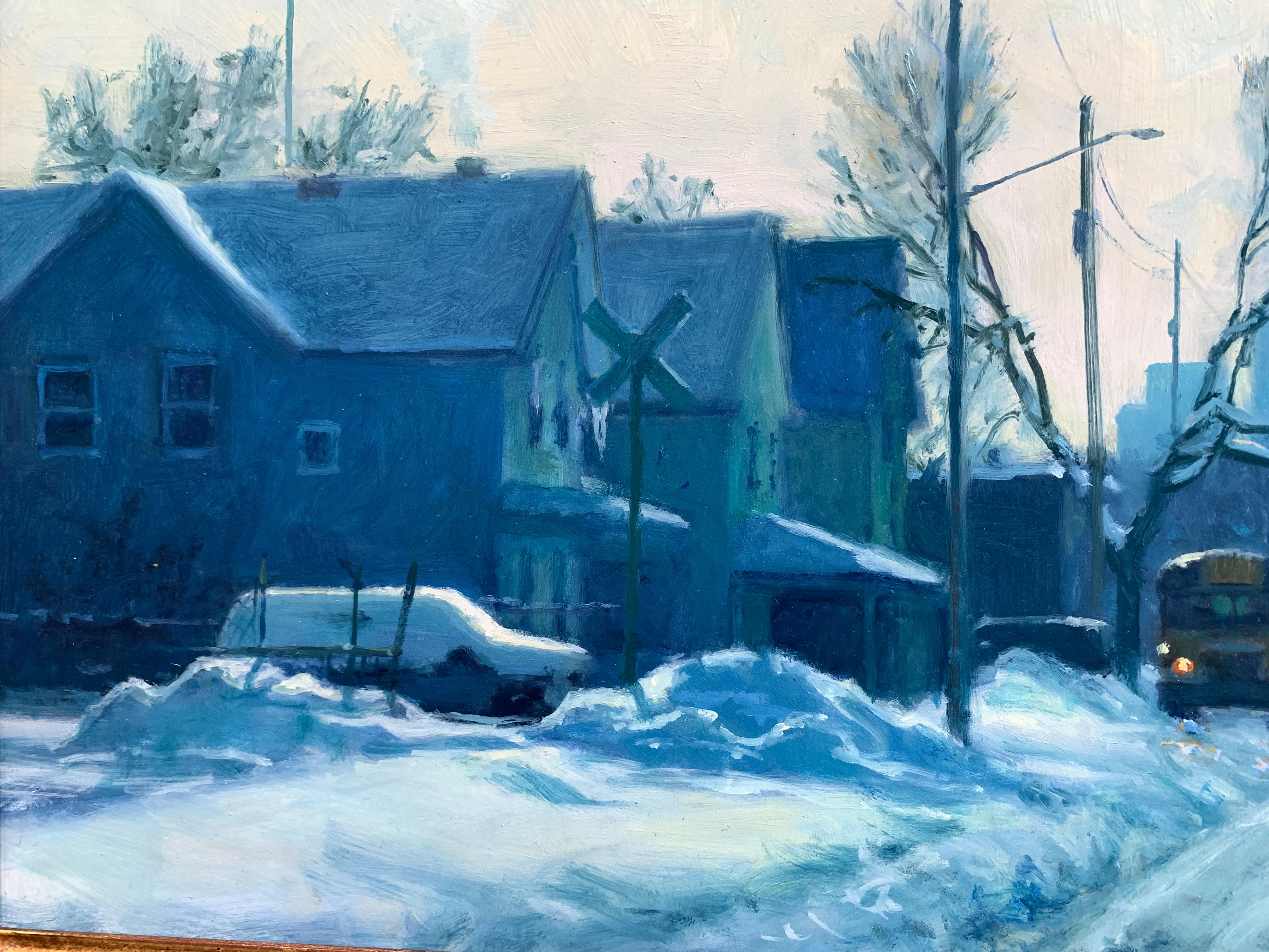 An oil painting of a snow-covered street, just outside the city in Minneapolis, Minnesota. The city skyline can be seen in the center horizon. A billow of smoke rises upward from a warehouse structure to the right. Suburban houses line the left side