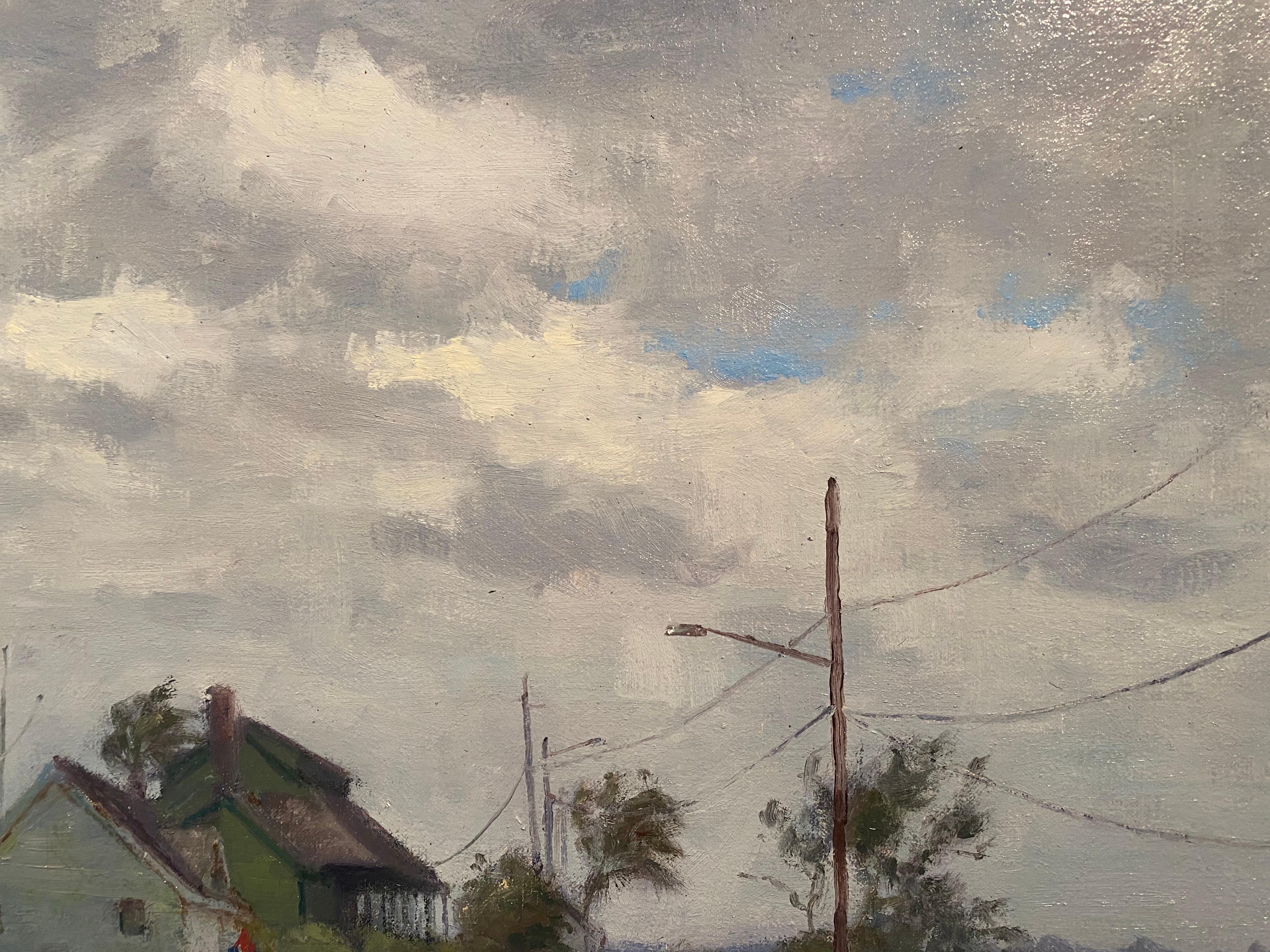 An oil painting of a landscape in Florida. The house of Refuge Museum showcases historic work from entrepreneurs and inventors. Bretzke captured it on a grey day, blue sky pokes out of whispy grey clouds. The presence of man is apparent in, two