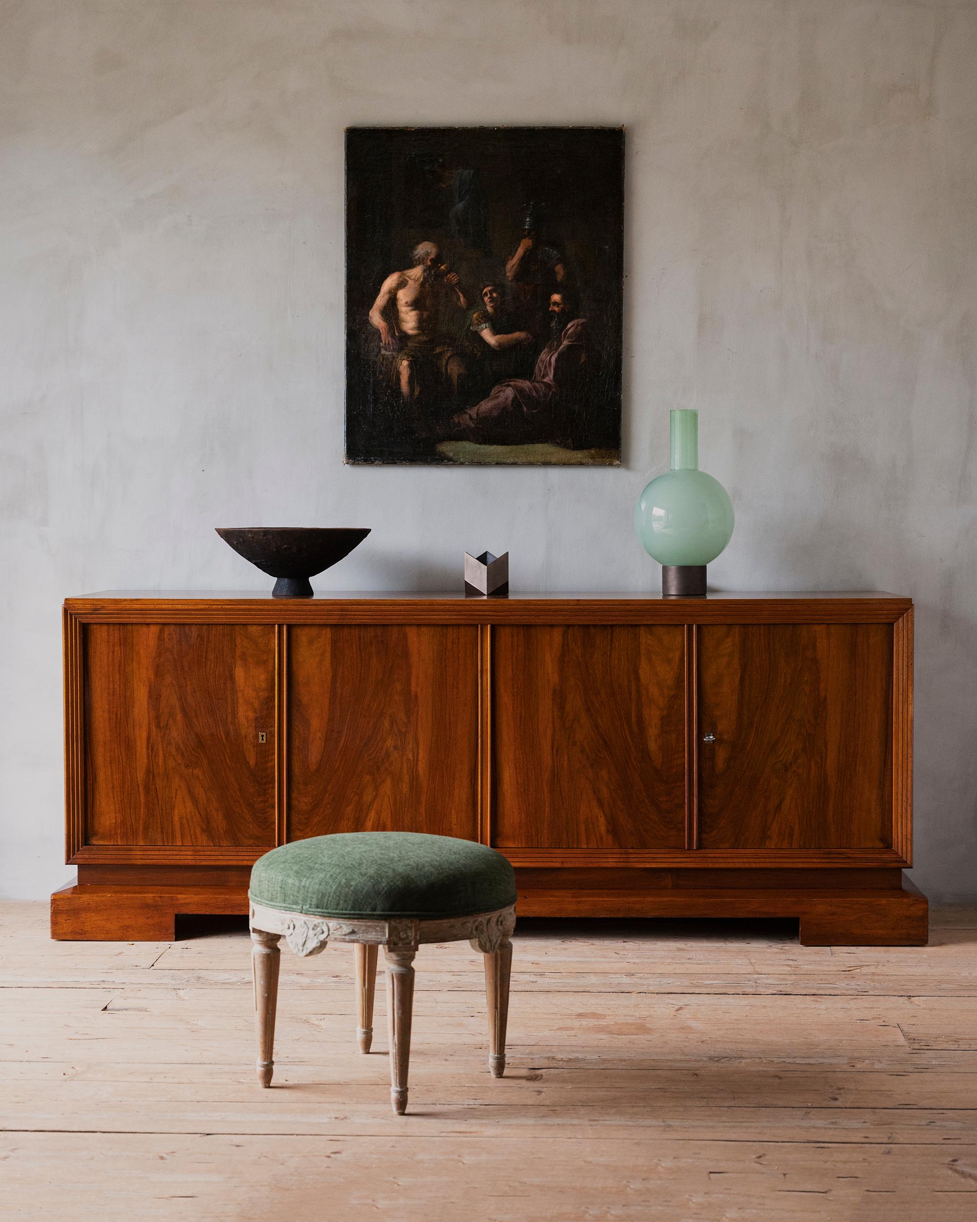 Rare early 1940s Swedish Modern mahogany sideboard with five drawers and shelves in the interior. Attributed to Carl Cederholm for Stil och Form. 

Carl Cederholm (b. 1909) graduated from HKS, Tekniska Skolan, now Faculty of Arts in 1940 after three