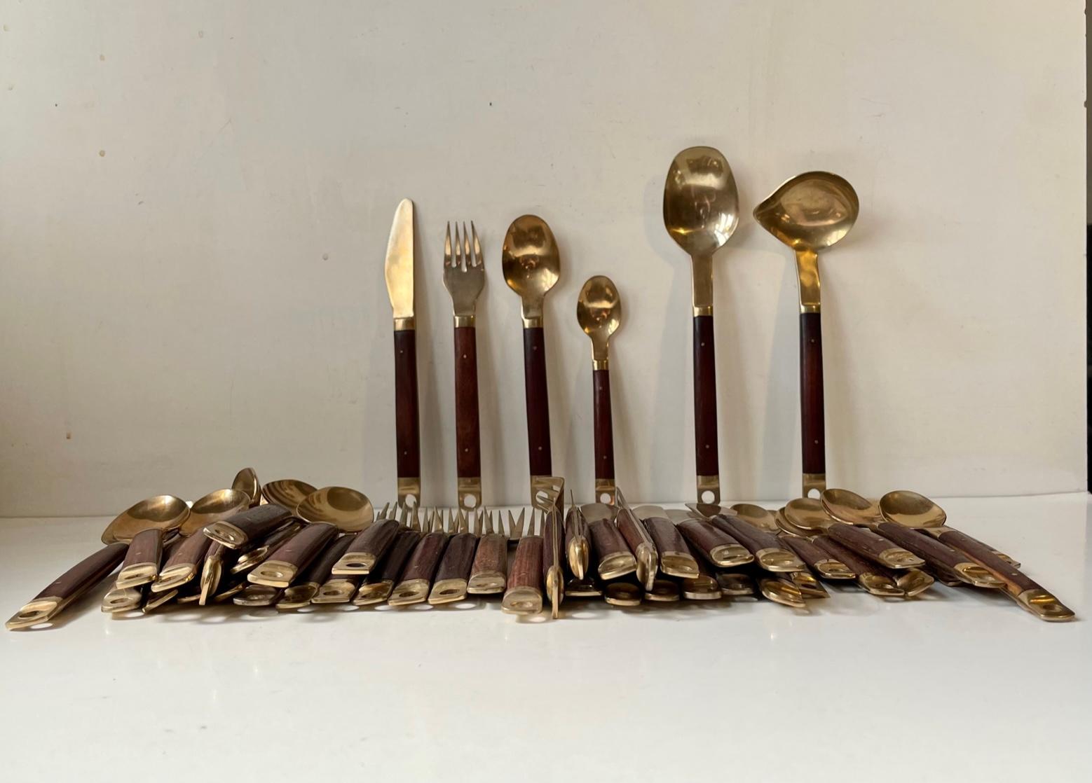 This dining/lunch set by Carl Cohr was manufactured and designed in Denmark during the early 1960s. The set consists of 12 dinner knives, 12 dinner forks, 12 dinner spoons, 12 tea spoons, 1 potato spoon and 1 sauce spoon . A rather practical feature