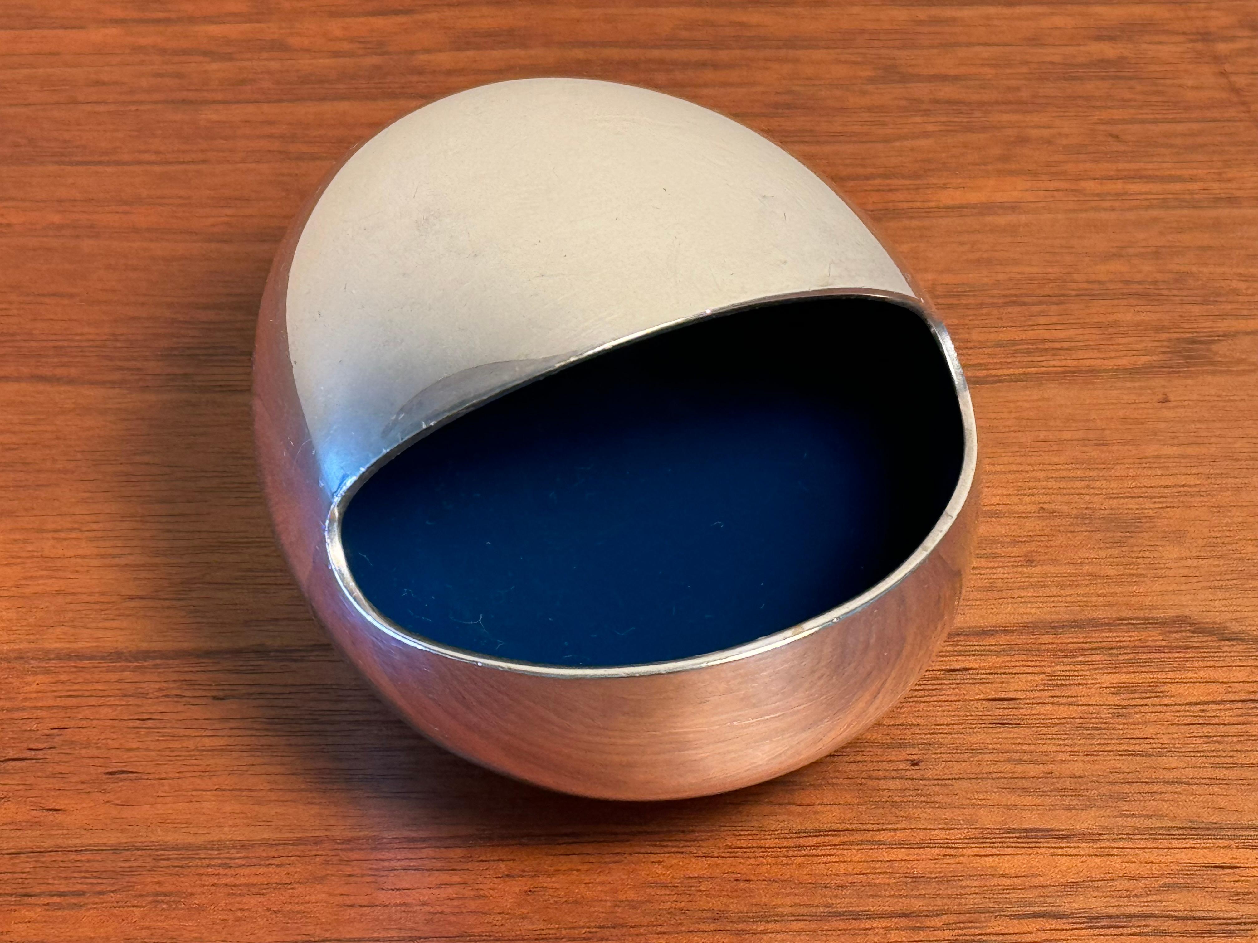 Silvered metal ashtray designed by Hans Bunde and produced by Carl Cohr of Denmark. Called 