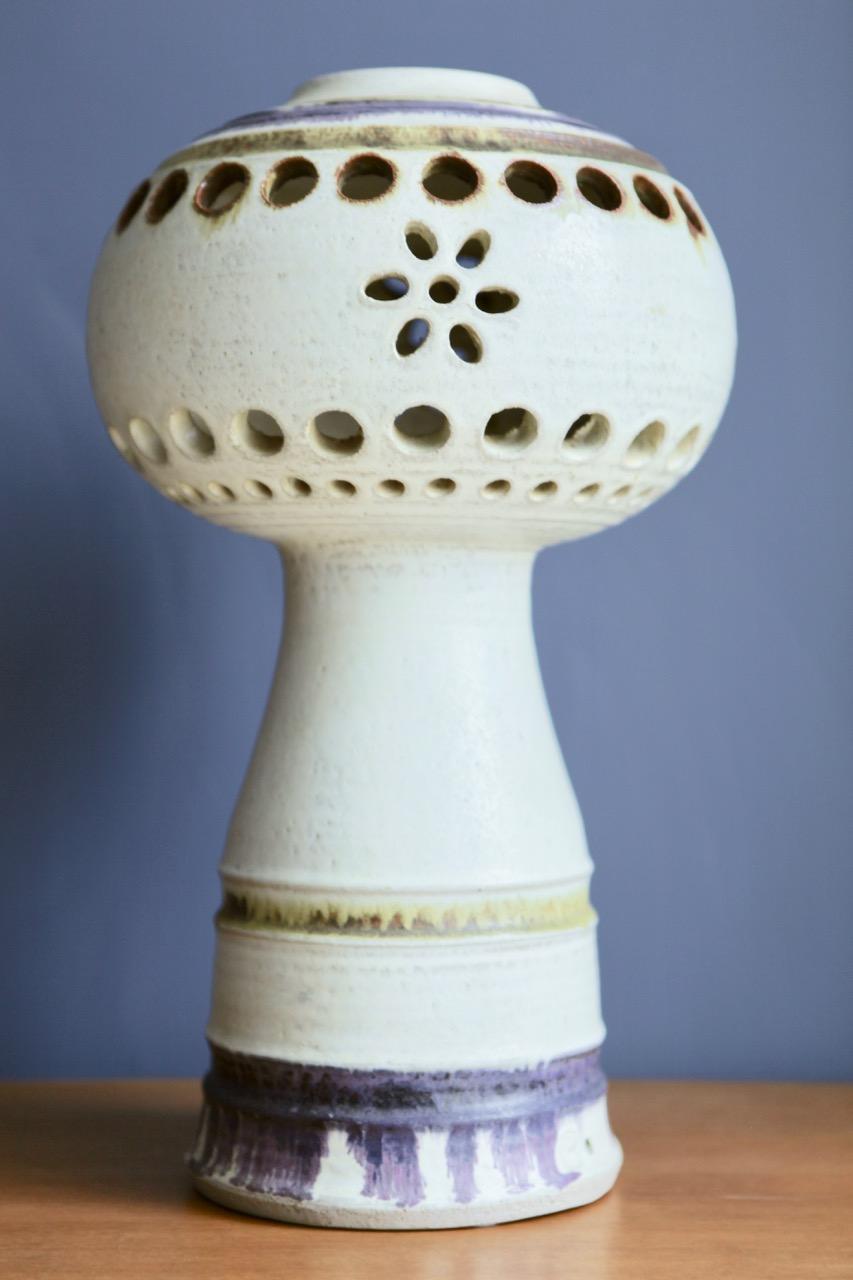 A large and partly pierced stoneware object, decorated in purple and ochre colors, by Carl Cunningham-Cole, manufactured by Kähler in Denmark in the 1960s.
Signed to the underside.