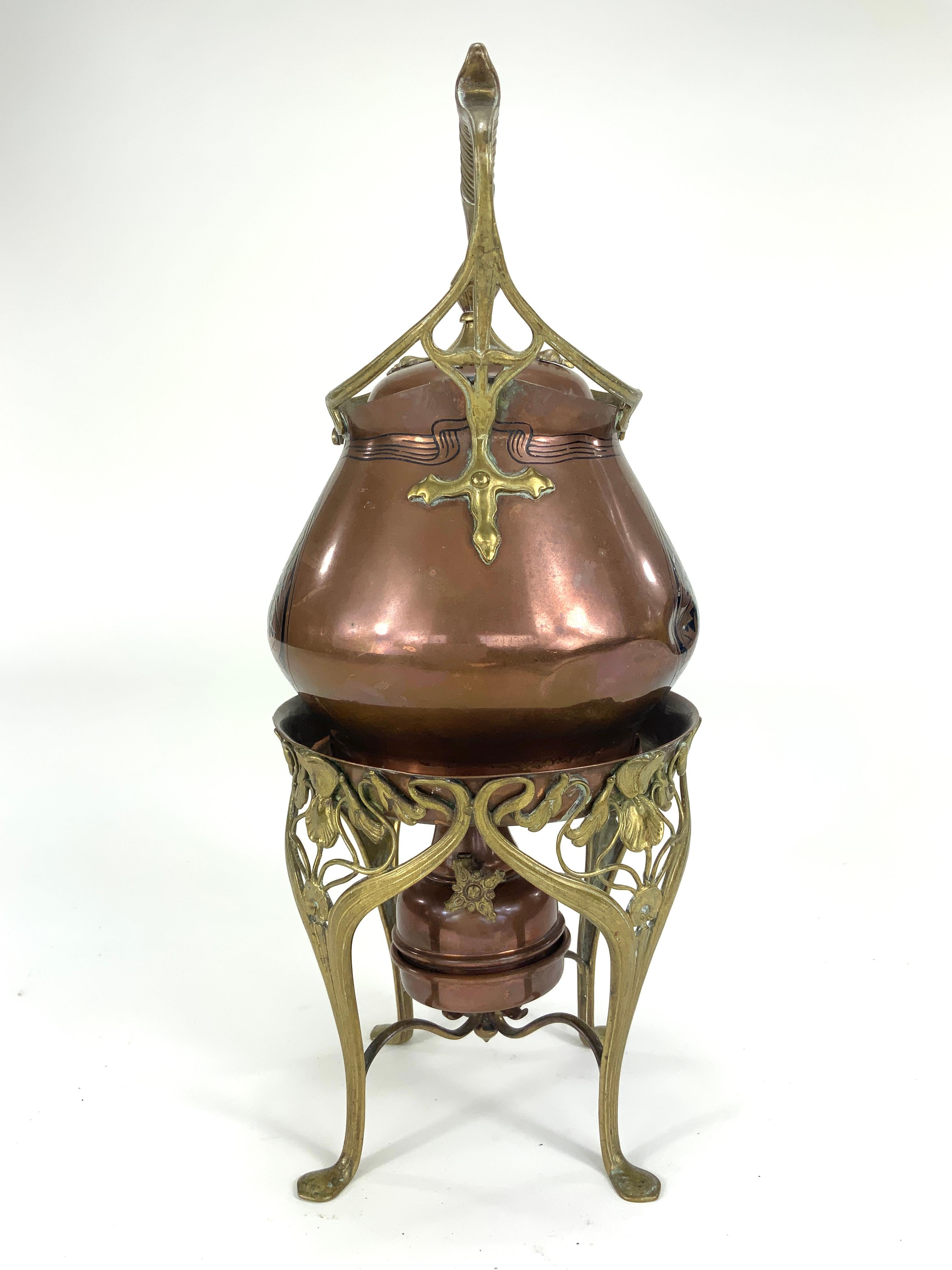 Carl Deffner (1856-1946) Art Nouveau Copper Tea Kettle on a Comfort circa 1895-1900, Germany.

This Carl Deffner teapot on a conforming stand with a spirit burner, circa 1895-1900 was made during the height of the Art Nouveau era. The pot is