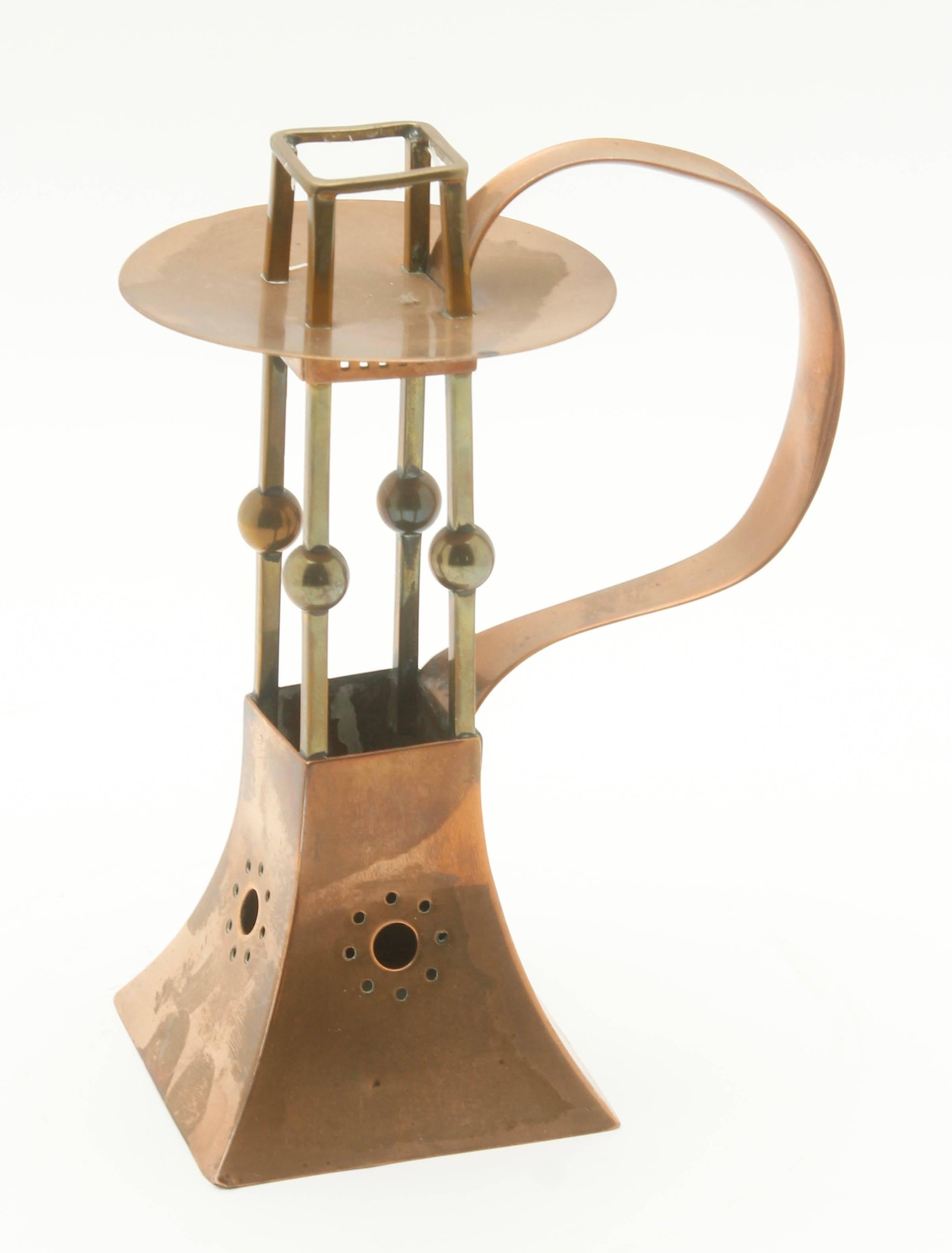 C.D.E Werks of Carl Deffner (1856-1948) of Esslingen, Germany

superb Jugendstil copper and brass candle stick by the famous C.D.E Werks of Carl Deffner of Esslingen, Germany. The base, handle and drip tray are constructed of copper and the