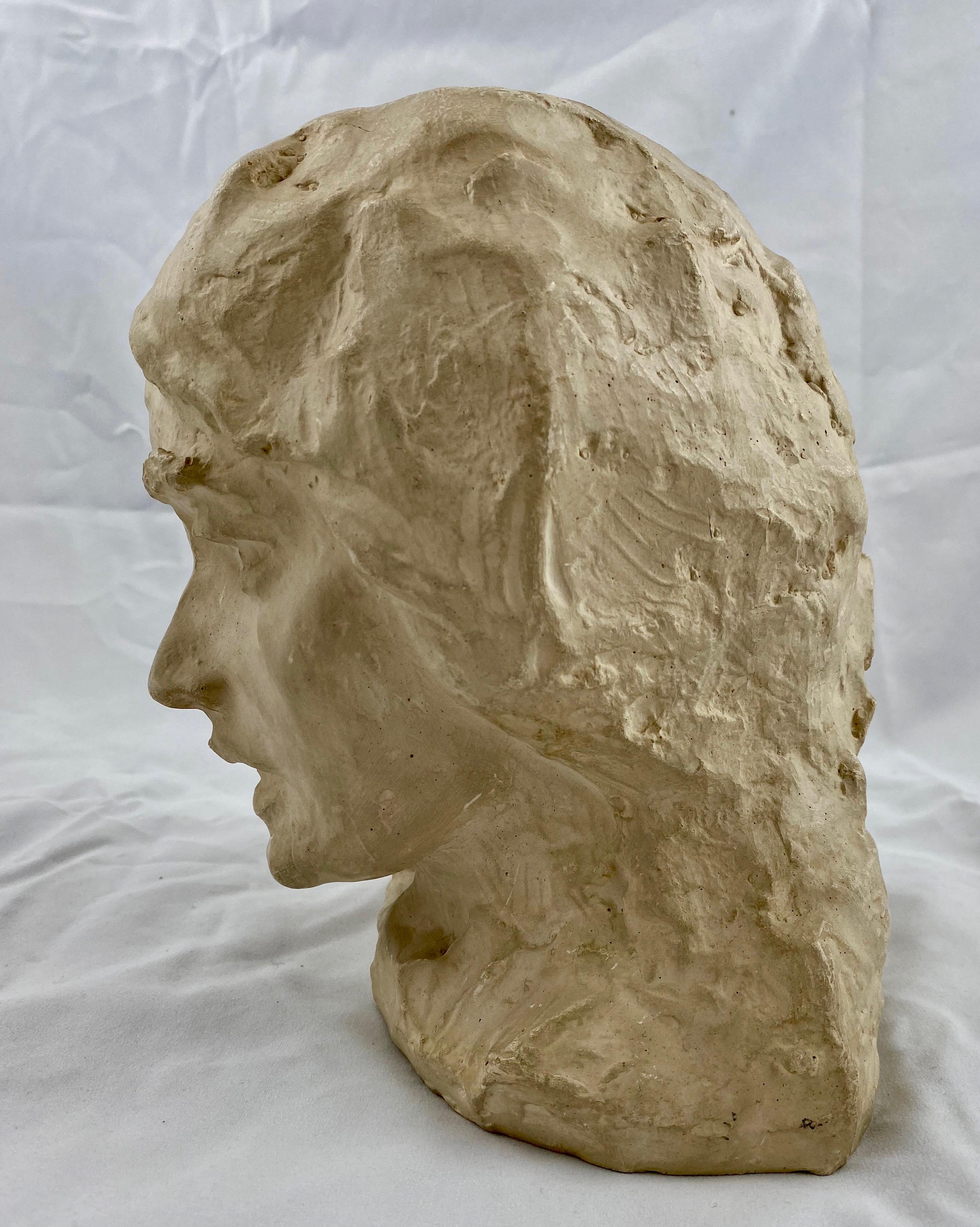 A plaster bust by Carl Eldh (1873-1954) depicting an old woman. Signed Carl Eldh and numbered 8/85.