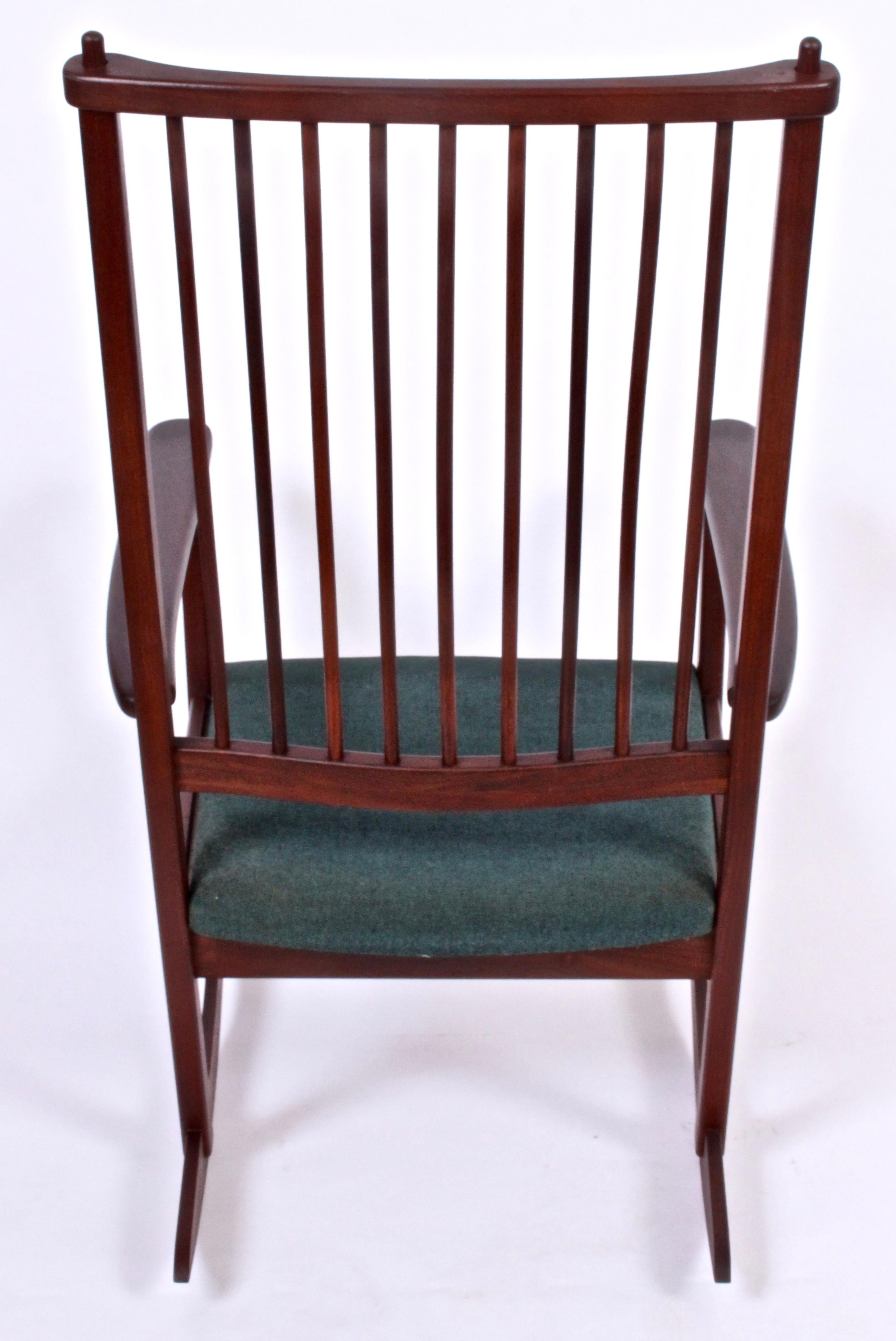 Scandinavian Modern Ynge Ekstrom for Swedes solid Rosewood Rocking Chair. Design attributed to Karl-Erik Ekselius.  Featuring a sturdy, solid Rosewood framework with wide, comfortable lightly padded seat, (19.5W front x 18W rear x 19.75D)