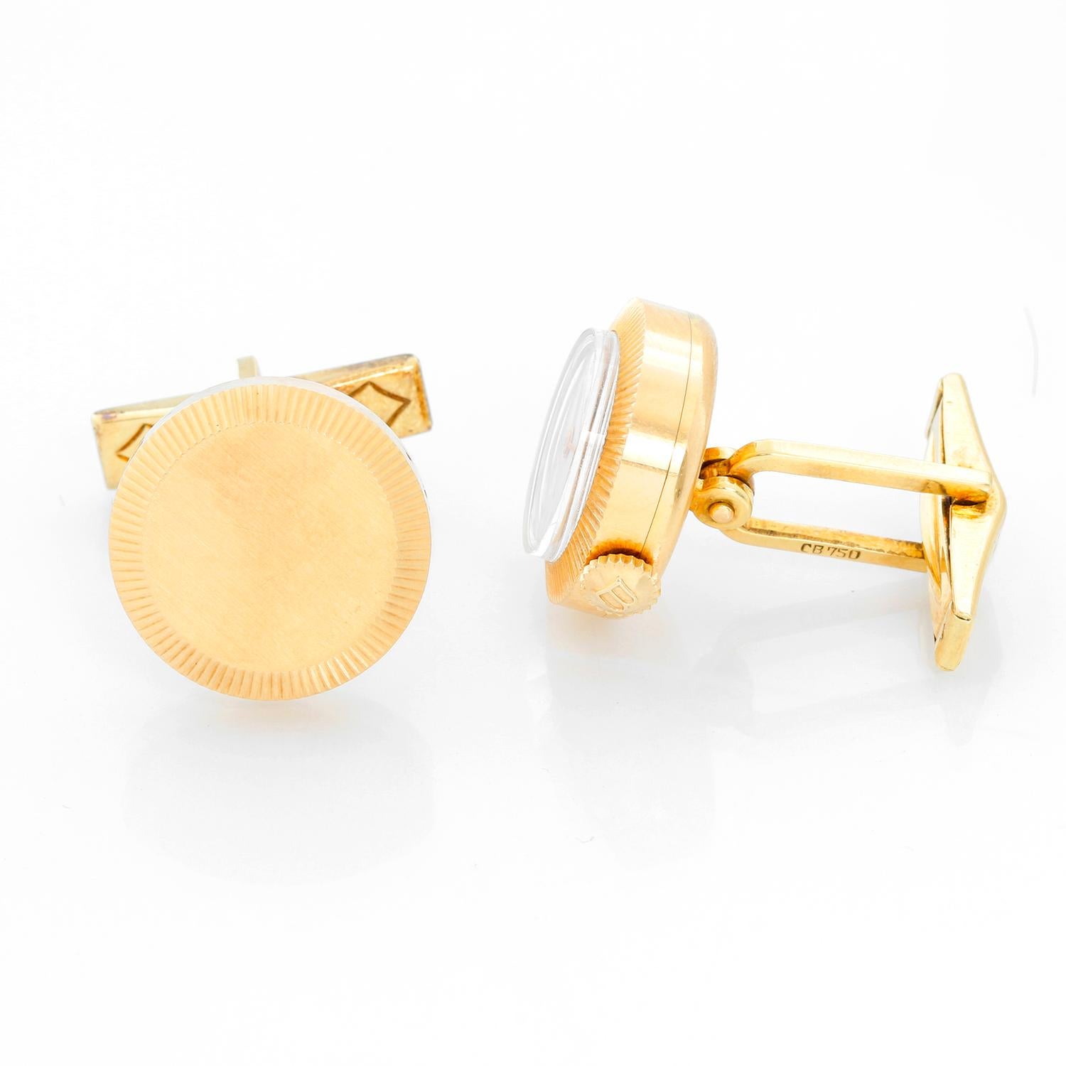 Carl F. Bucherer 18K Yellow Gold Cufflinks Watch - 18K Yellow gold ( 18 mm ). White dial with stick hour markers . Unusual 18k yellow gold cufflinks by Swiss watchmaker Carl Bucherer, in which one of the links is a working watch. Bucherer was known