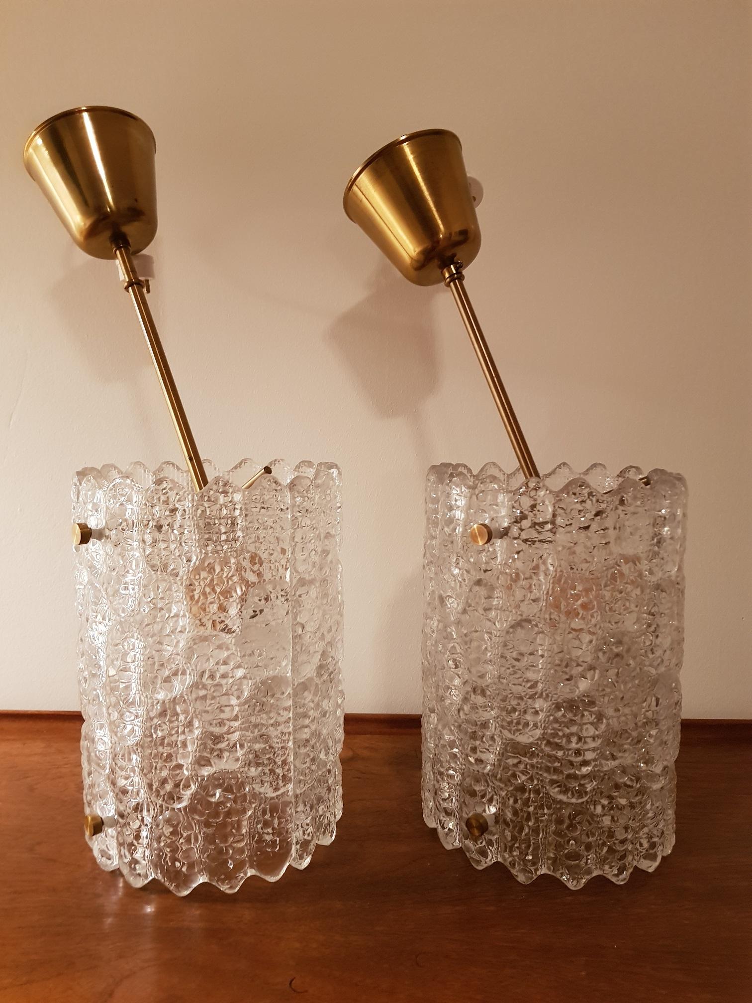 2 vintage ceiling lamps in brass and handcrafted glass from Orrefors in Sweden. Model RD 1322. Produced in the 1960s by Swedish Orrefors. Scandinavian Modern design with the traditional brass and glass combination. Swedish Carl Fagerlund is famous