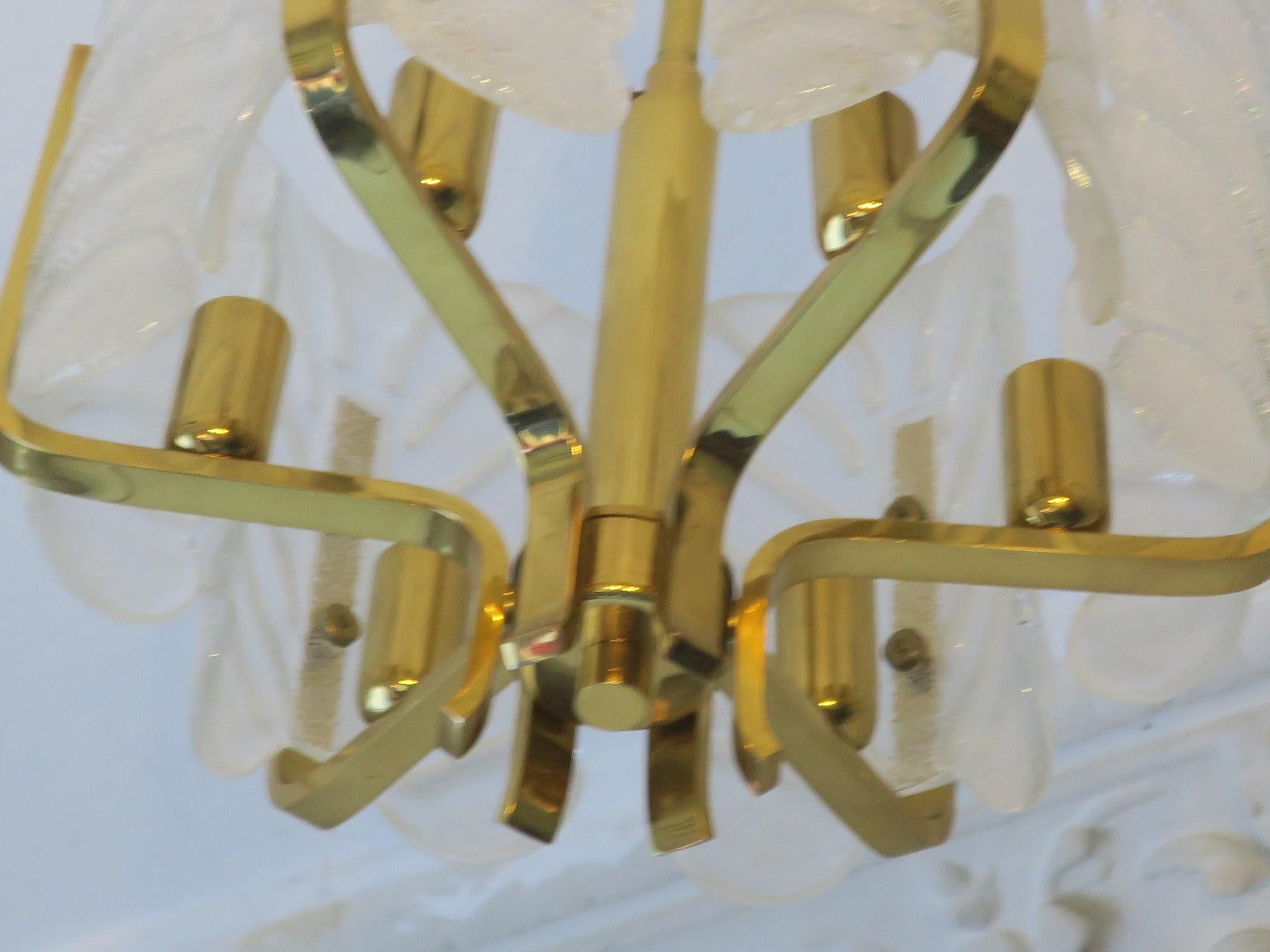 An elegant brass chandelier by Carl Fagerlund for Orrefors dating from the 1960s. The chandelier has six glittering frosted glass shades in the shape of acanthus leaves.

If sold to the US will be adapted for standard US candelabra bulbs.