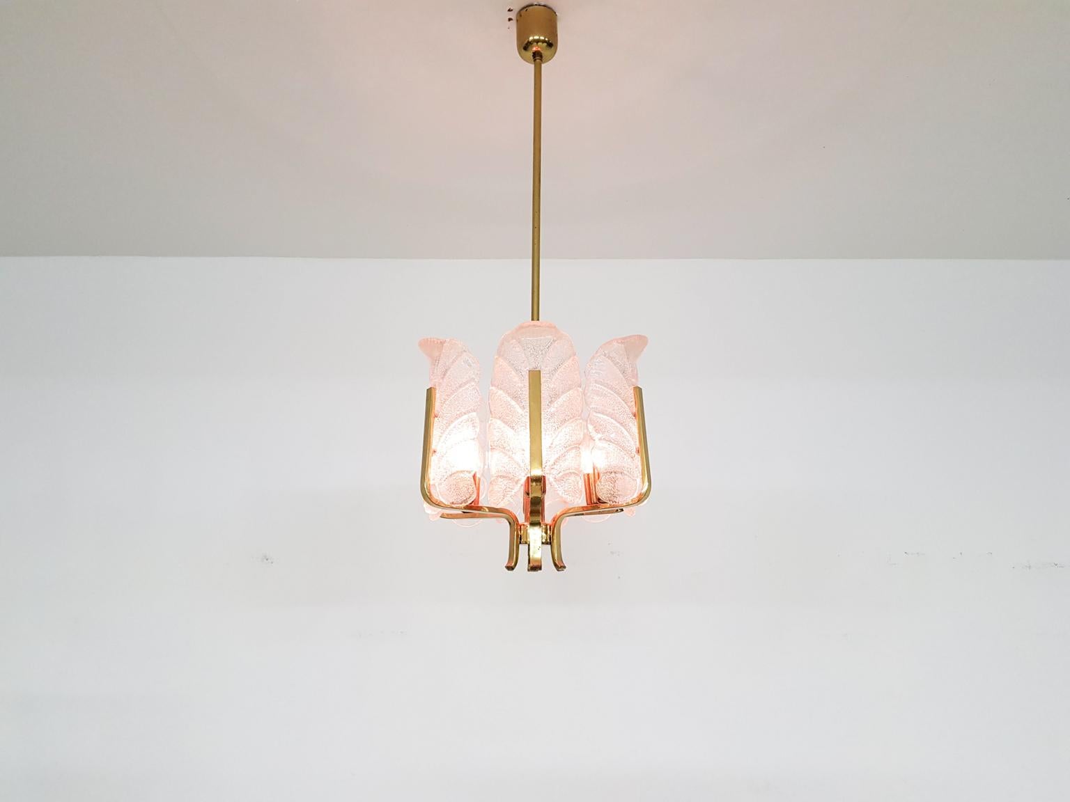 High quality brass and glass chandelier or pendant designed by Carl Fagerlund for Orrefors in Sweden in the 1960's.

Carl Fagerlund was a Swedish designer born in the first half of the 20th century. He mainly worked for Orrefors a high end