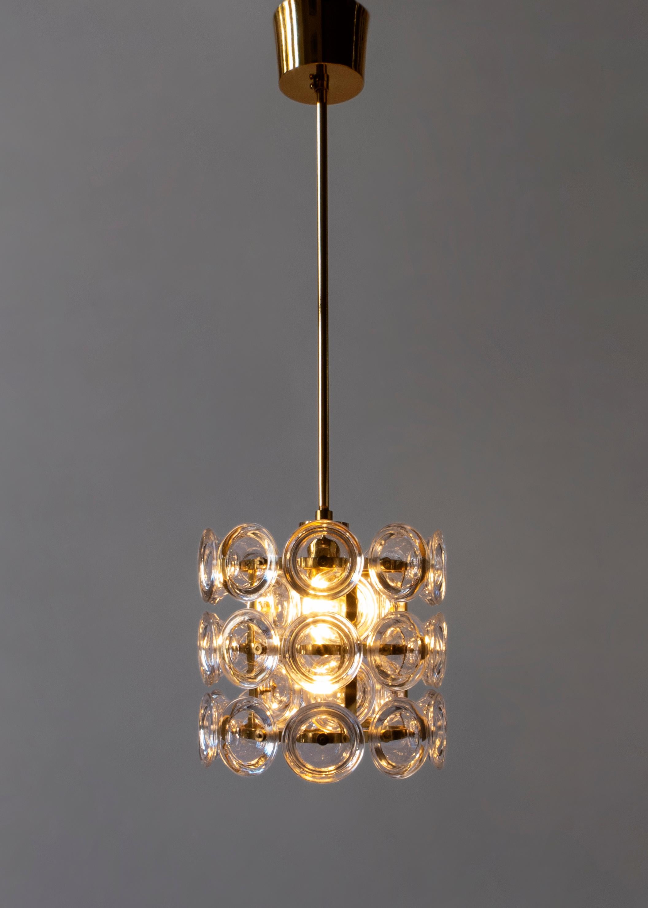 Carl Fagerlund for Orrefors Exceptional Pair of Swedish Glass and Brass Pendants In Good Condition In Philadelphia, PA