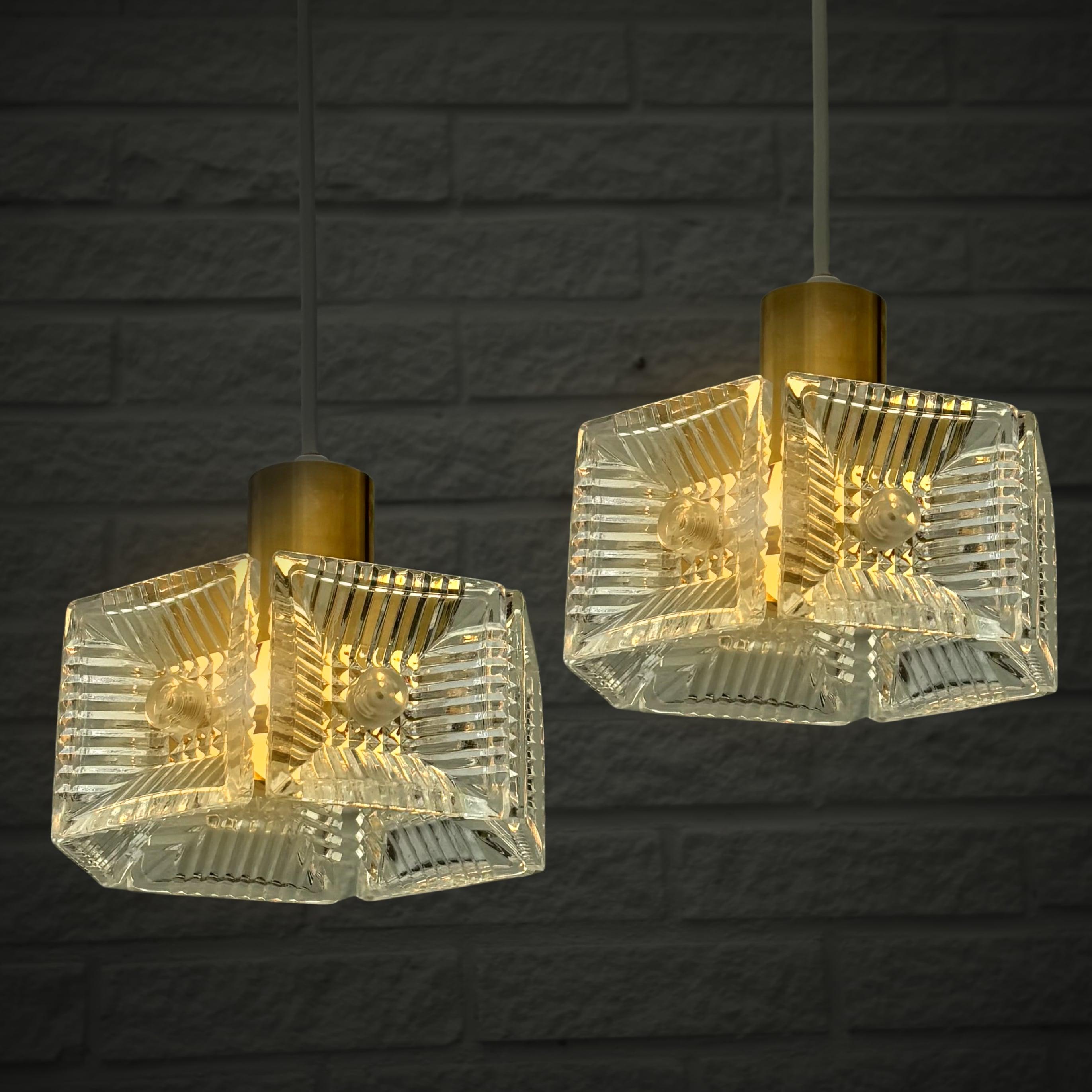 Scandinavian Modern Carl Fagerlund, Orrefors, a pair of pendant lamps, brass & glass, Sweden, 1960s For Sale