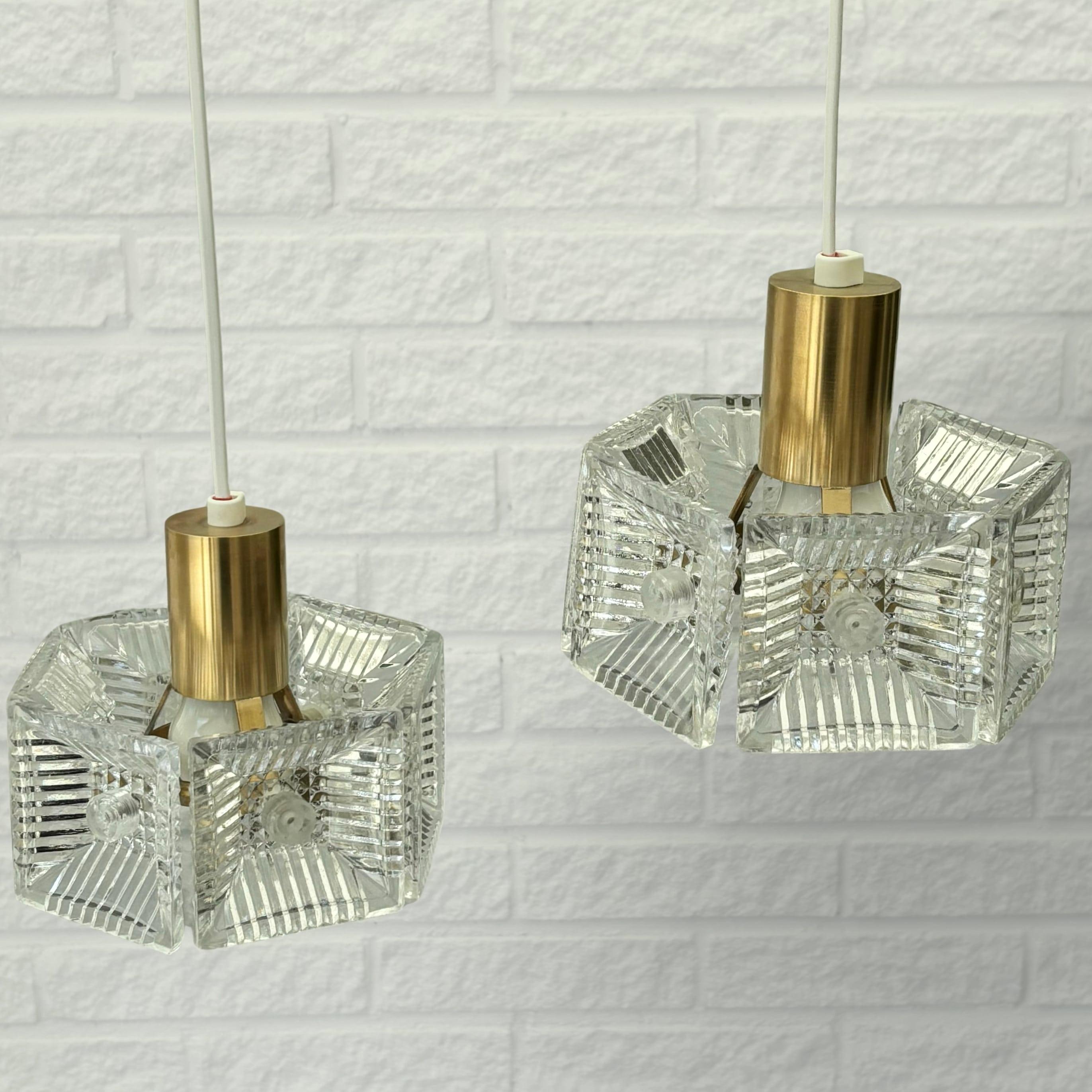Mid-20th Century Carl Fagerlund, Orrefors, a pair of pendant lamps, brass & glass, Sweden, 1960s For Sale