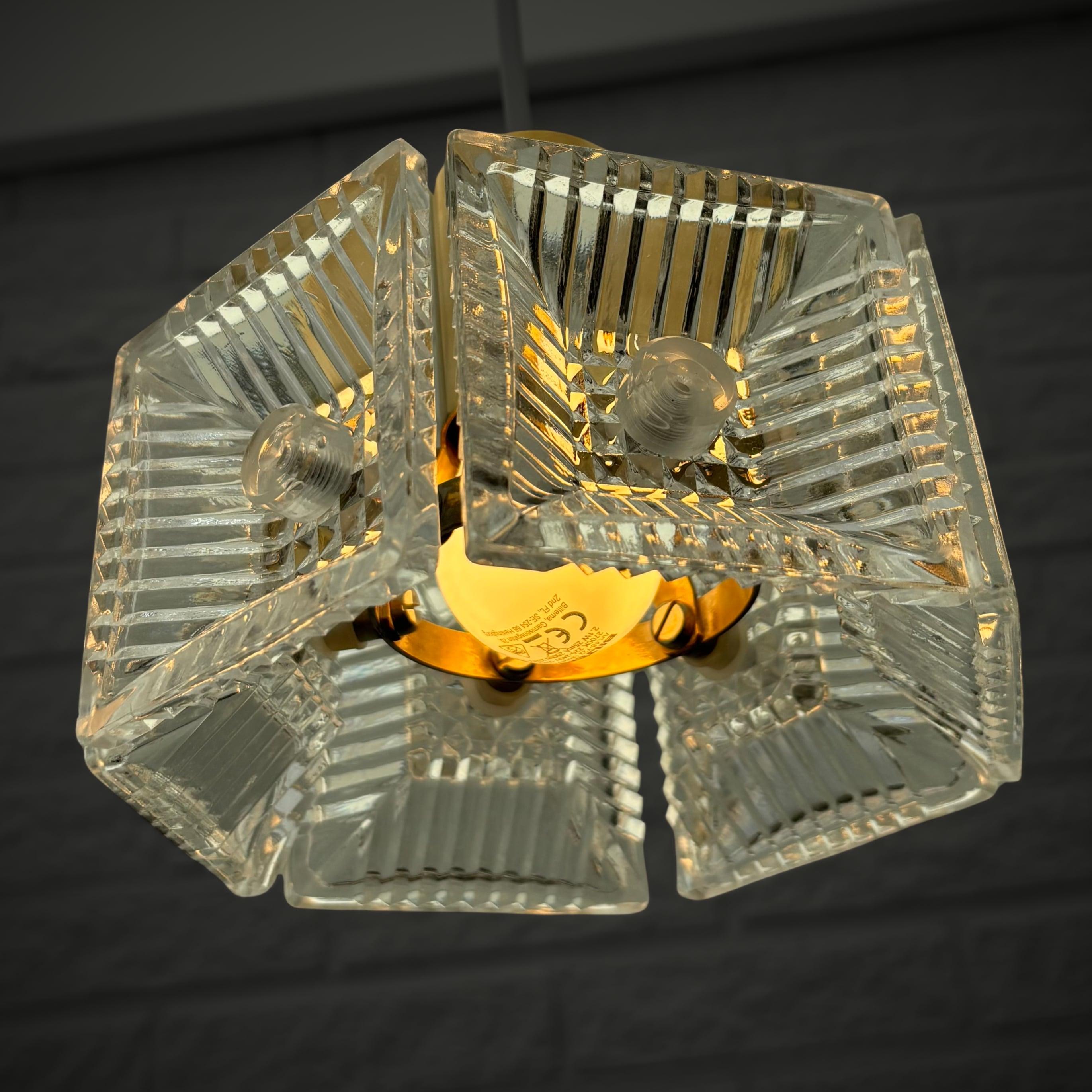 Brass Carl Fagerlund, Orrefors, a pair of pendant lamps, brass & glass, Sweden, 1960s For Sale