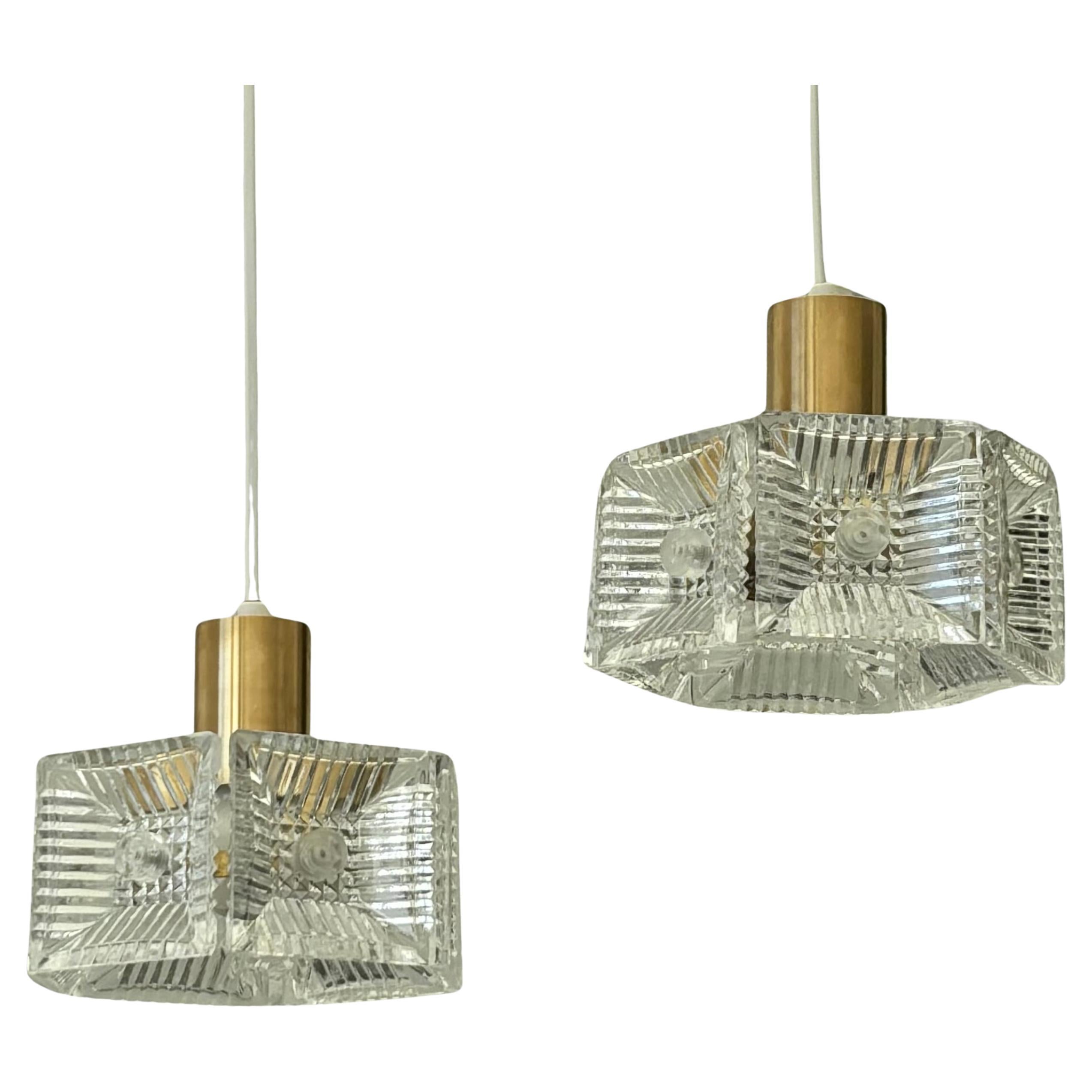 Carl Fagerlund, Orrefors, a pair of pendant lamps, brass & glass, Sweden, 1960s For Sale