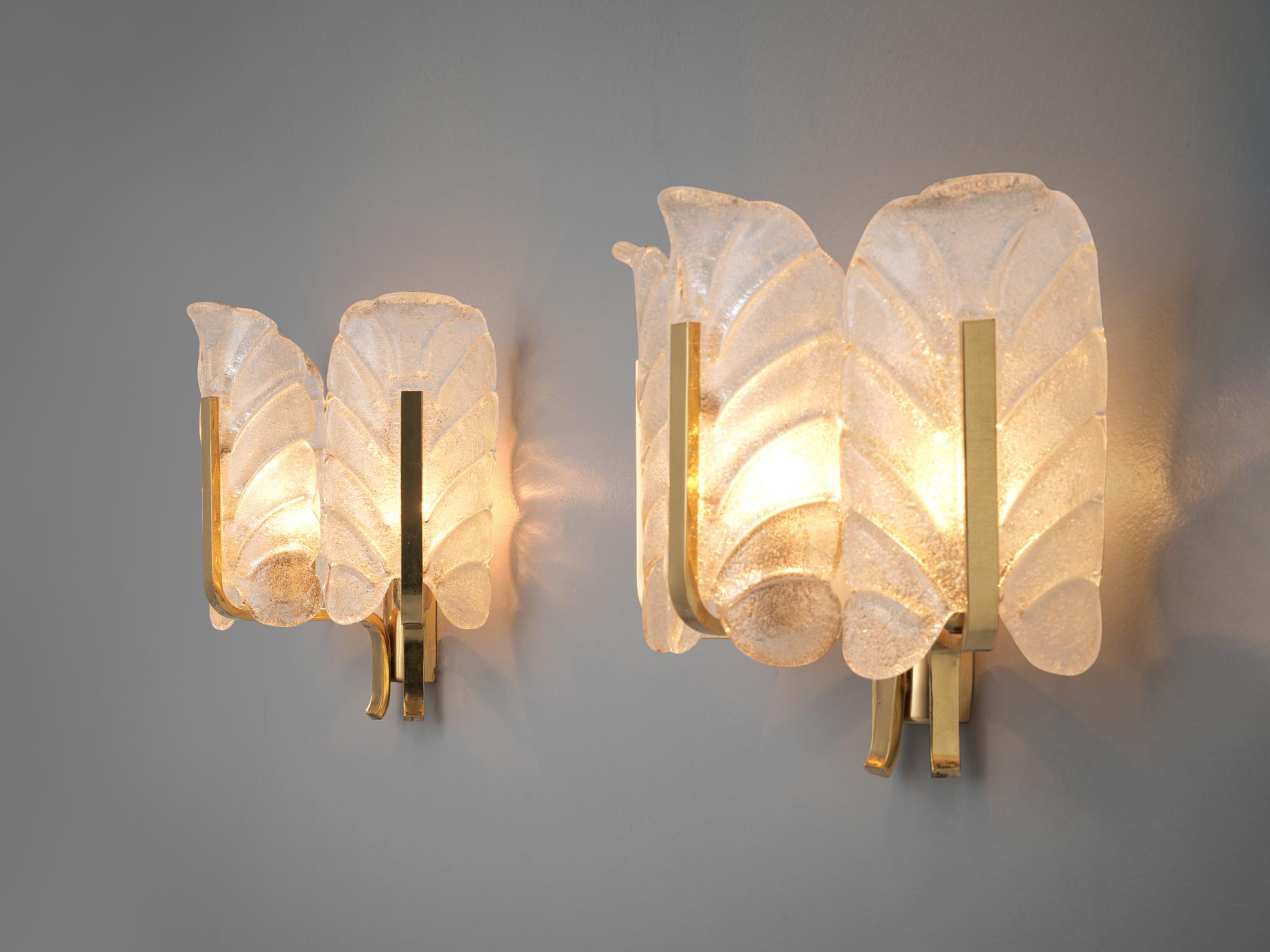 Carl Fagerlund, pair of wall lights, brass, glass, Europe, 1970s

Set of three elegant wall sconces in structured murano glass by Carl Fagerlund. Each light consists of three glass shades, all shaped like a structured leaf. Due the structure of