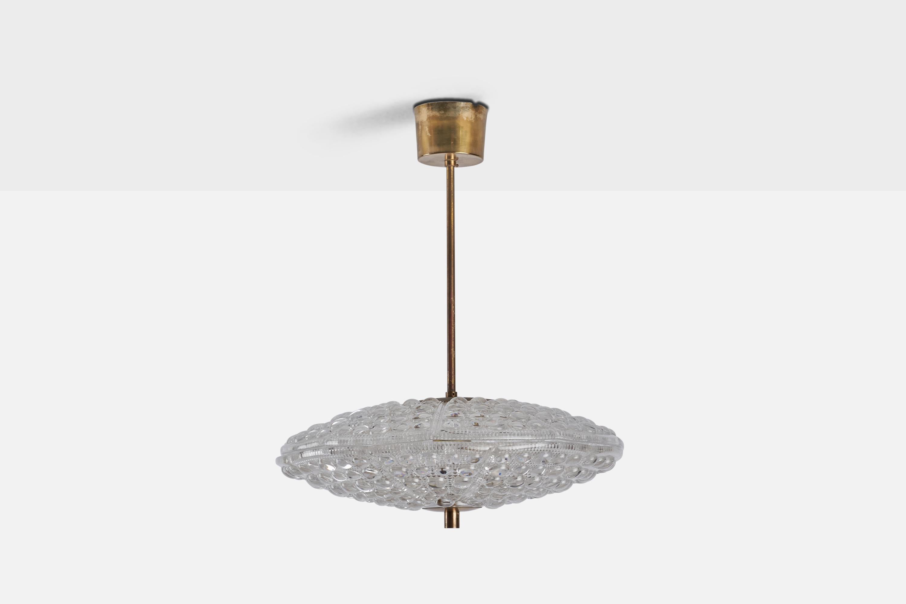 A brass and glass pendant light designed by Carl Fagerlund and produced by Orrefors, Sweden, 1940s.
Dimensions of canopy (inches) : 2.3” H x 3.4” Diameter
Socket takes standard E-14 bulb. There is no maximum wattage stated on the fixture. All