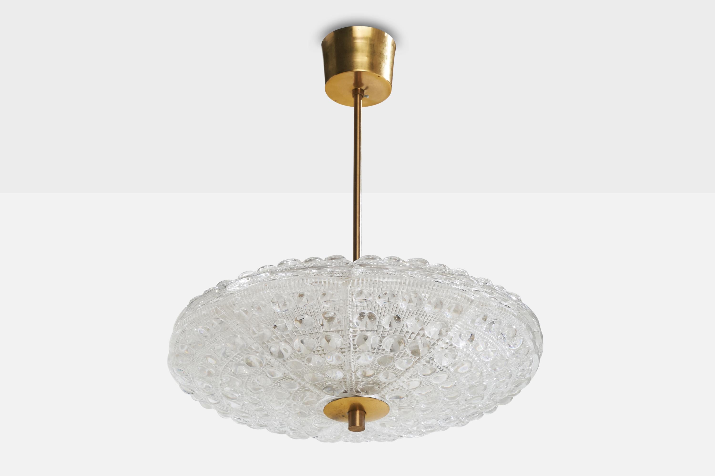 A brass and glass pendant light designed by Carl Fagerlund and produced by Orrefors, Sweden, 1940s.

Overall Dimensions (inches):  19” H x 16” Diameter

Dimensions of Canopy: 2.75” H x 3.5” W x 3.5” D

Stem length: 11.5” H

Bulb