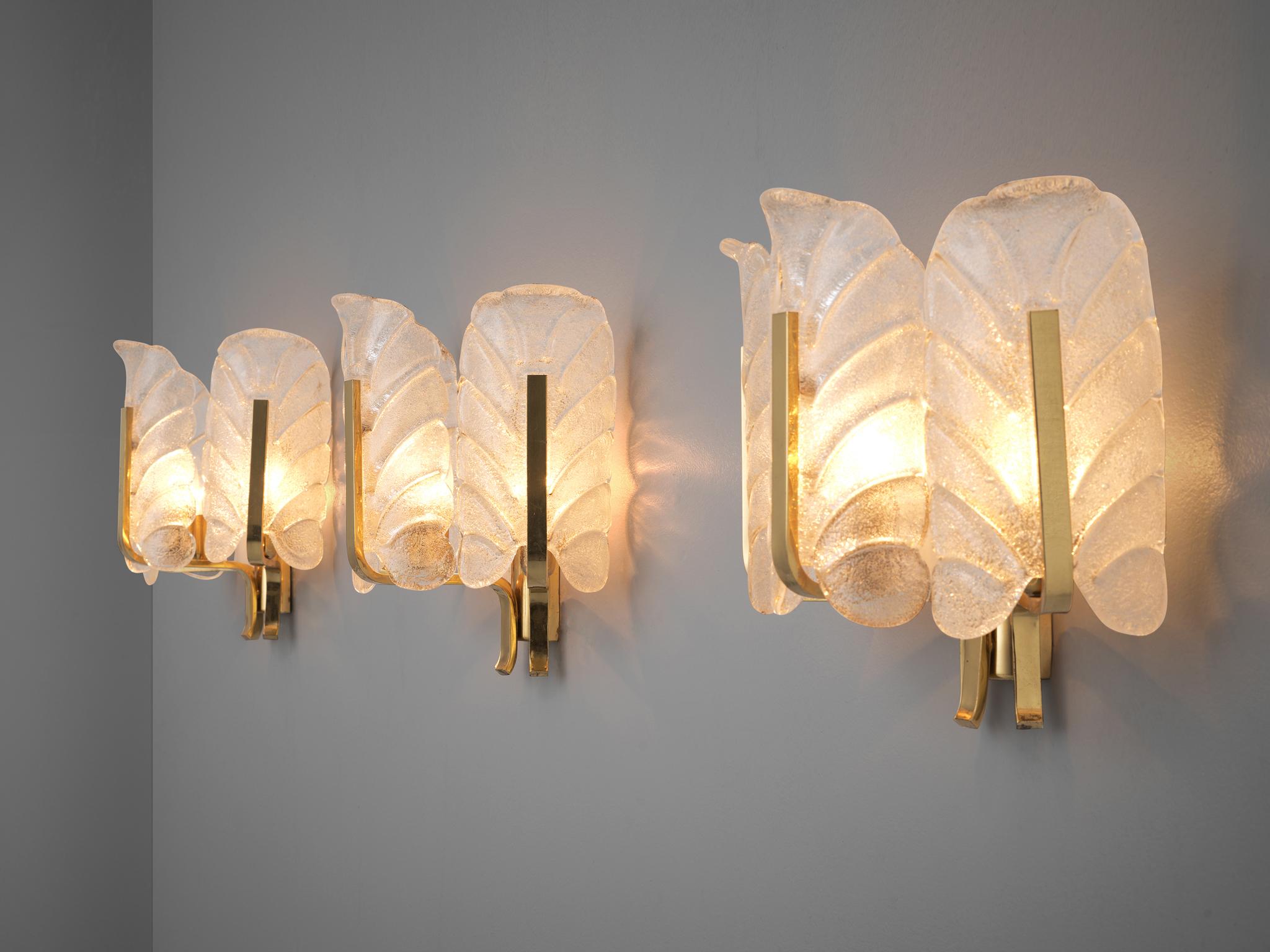 Carl Fagerlund, wall lights, brass, glass, Europe, 1970s

Six elegant wall sconces in structured Murano glass by Carl Fagerlund. Each light consists of three glass shades, all shaped like a structured leaf. Due the structure of the glass and the