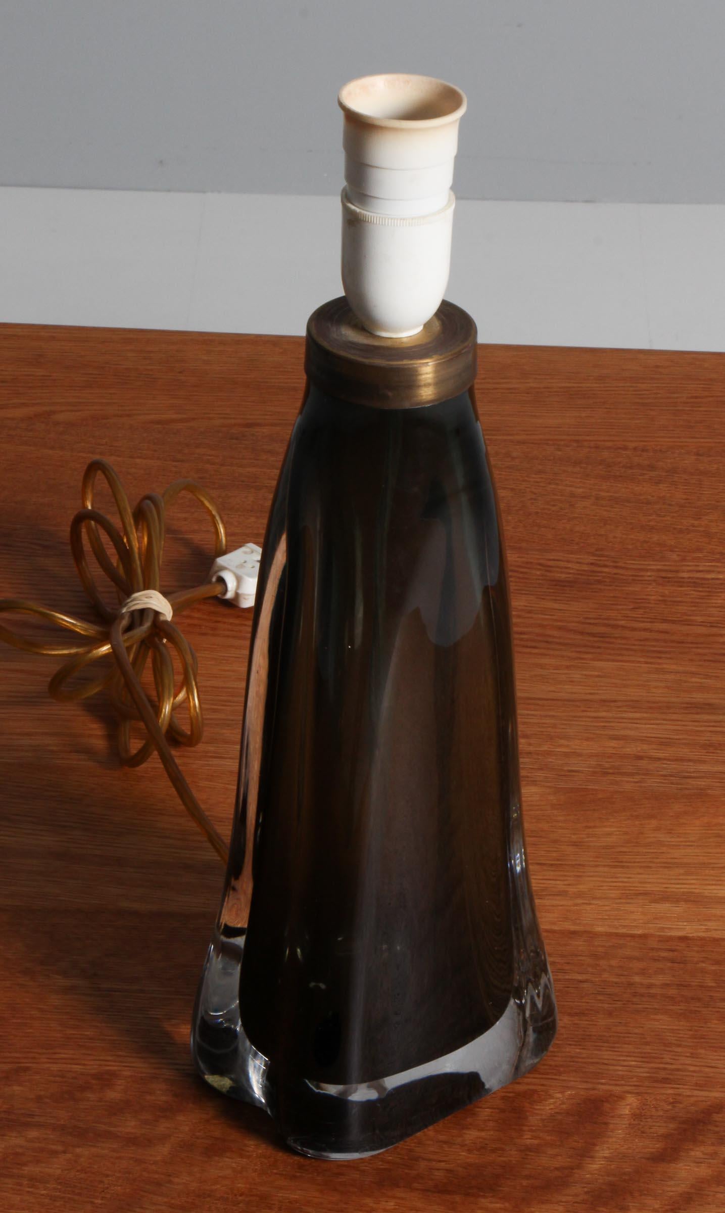 Carl Fagerlund table lamp in glass

Made by Orrefors.