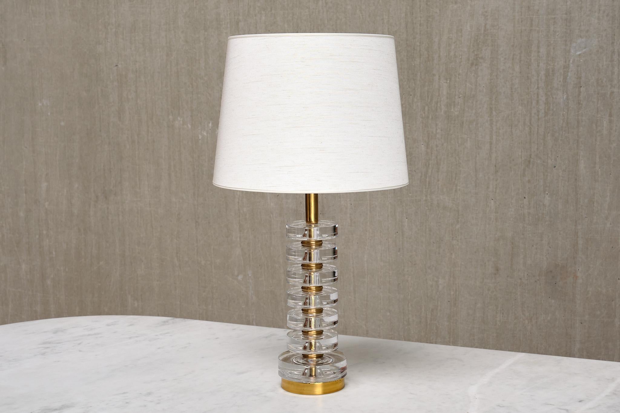 This rare table lamp was designed by Carl Fagerlund and produced by Orrefors in Sweden during the 1950s. The lamp is marked with the model number RD 1983 and 