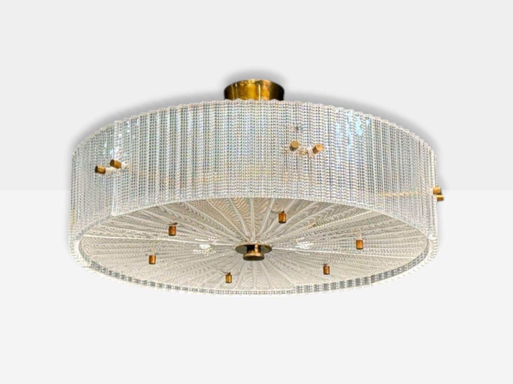 Carl Fagerlund, Swedish Modern, Textured Glass, Brass, Pendant Light or Chandelier, Sweden, 1960s

A drum shaped pendant light in having intricate textured glass panels and brass supports/canopy designed by Carl Fagerlund and produced by Orrefors in