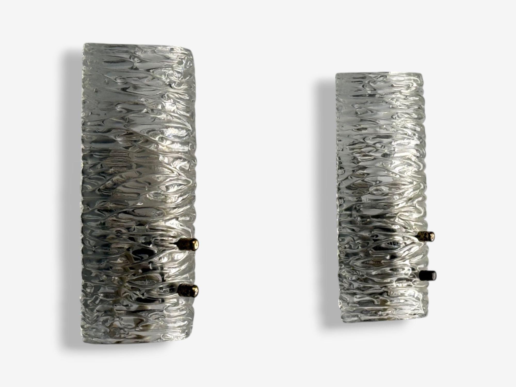 Carl Fagerlund, Textured Glass, Brass, Wall Lights, Sweden, 1960s

Pair of textured glass wall lights designed by Carl Fagerlund for Orrefors in Sweden c. 1960s. Each fixture has one E14 candelabra light socket. Re-wiring is recommended prior to