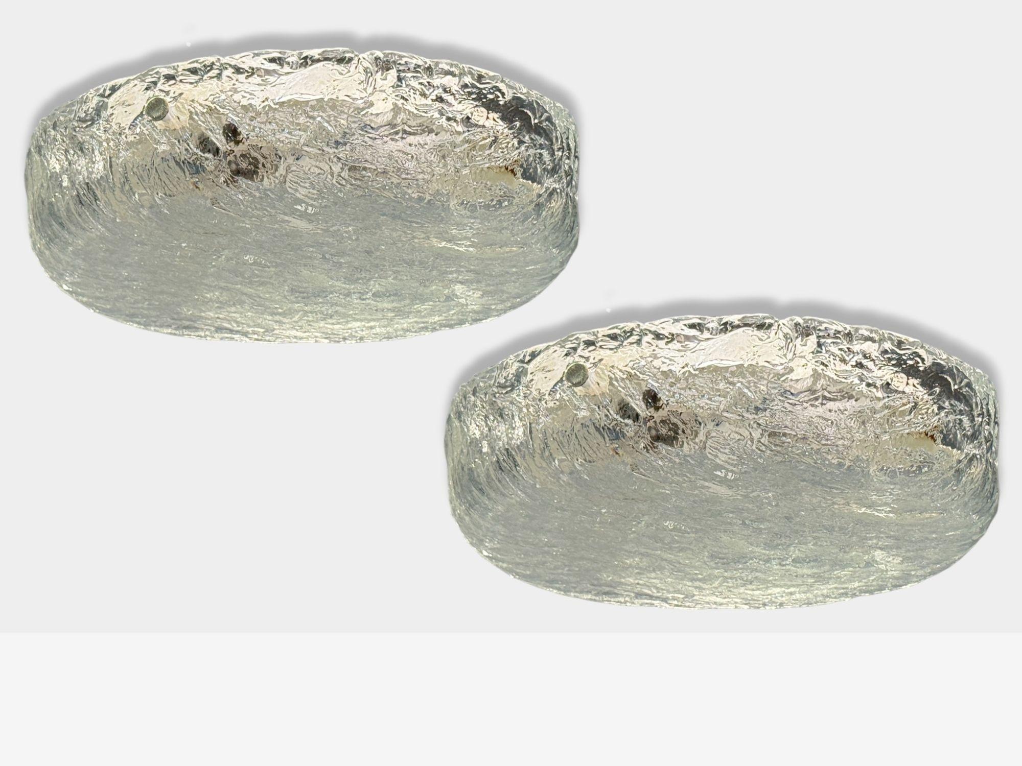 Carl Fagerlund, Swedish Mid-Century Modern, Textured Glass, Nickel, Flush Mount Fixtures, Sweden, 1950s

Pair of molded, textured glass and nickel flush mount fixtures designed and produced by Orrefors in Sweden in the middle of the 20th century.