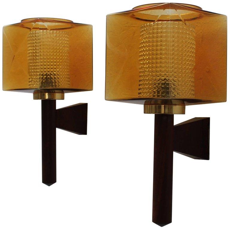 Carl Fagerlund wall sconces for Orrefors, Sweden, 1960. Rosewood and glass Perfect condition. Also wired for US use.