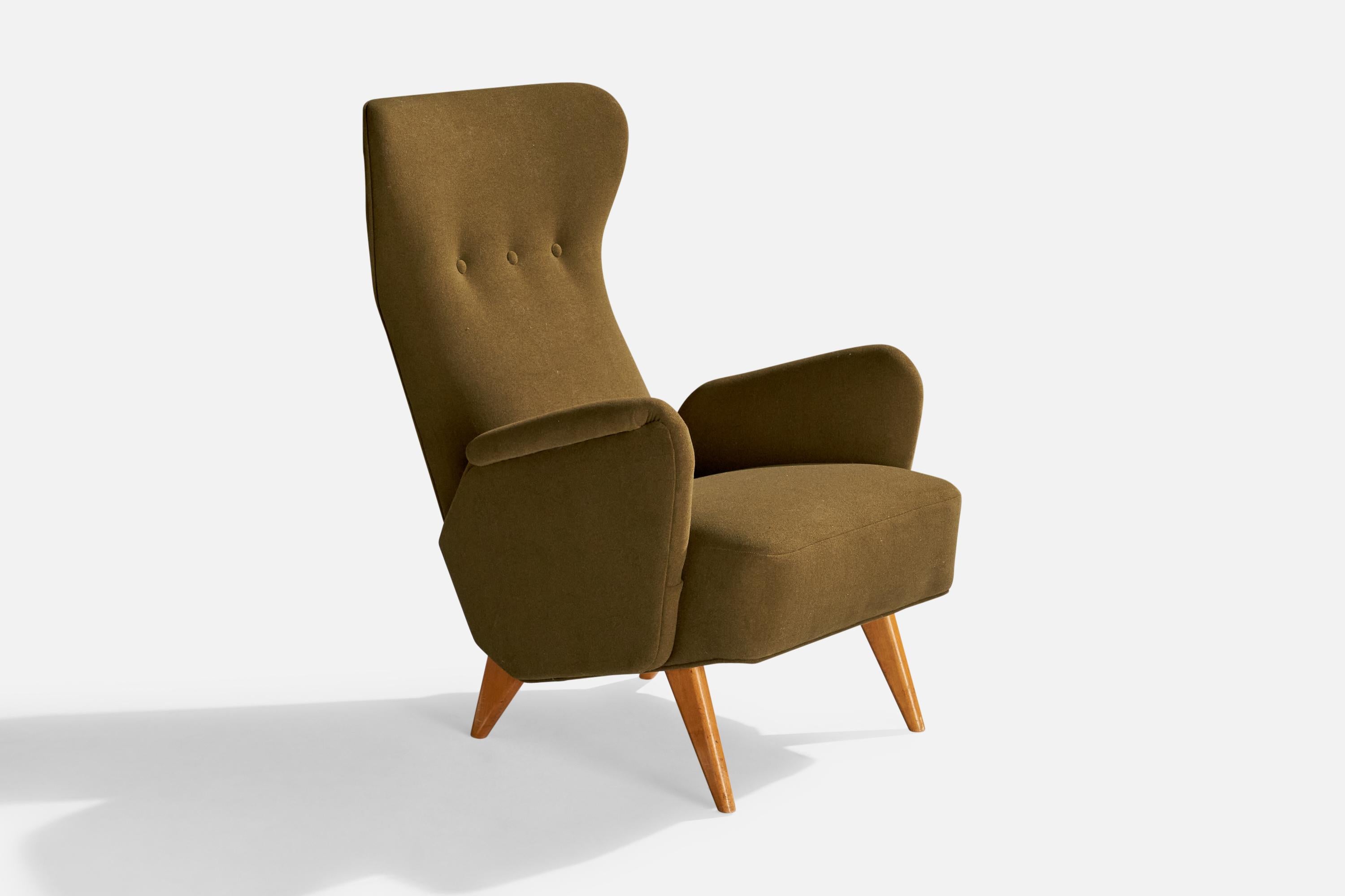 A green fabric and wood lounge chair designed by Carl Gustaf Hiort af Ornäs and produced by Hiort Tuote Puunveisto, Finland, c. 1940s.

Dimensions: 37.75” H x 26.25” W x 29” D

Seat height: 15.75”