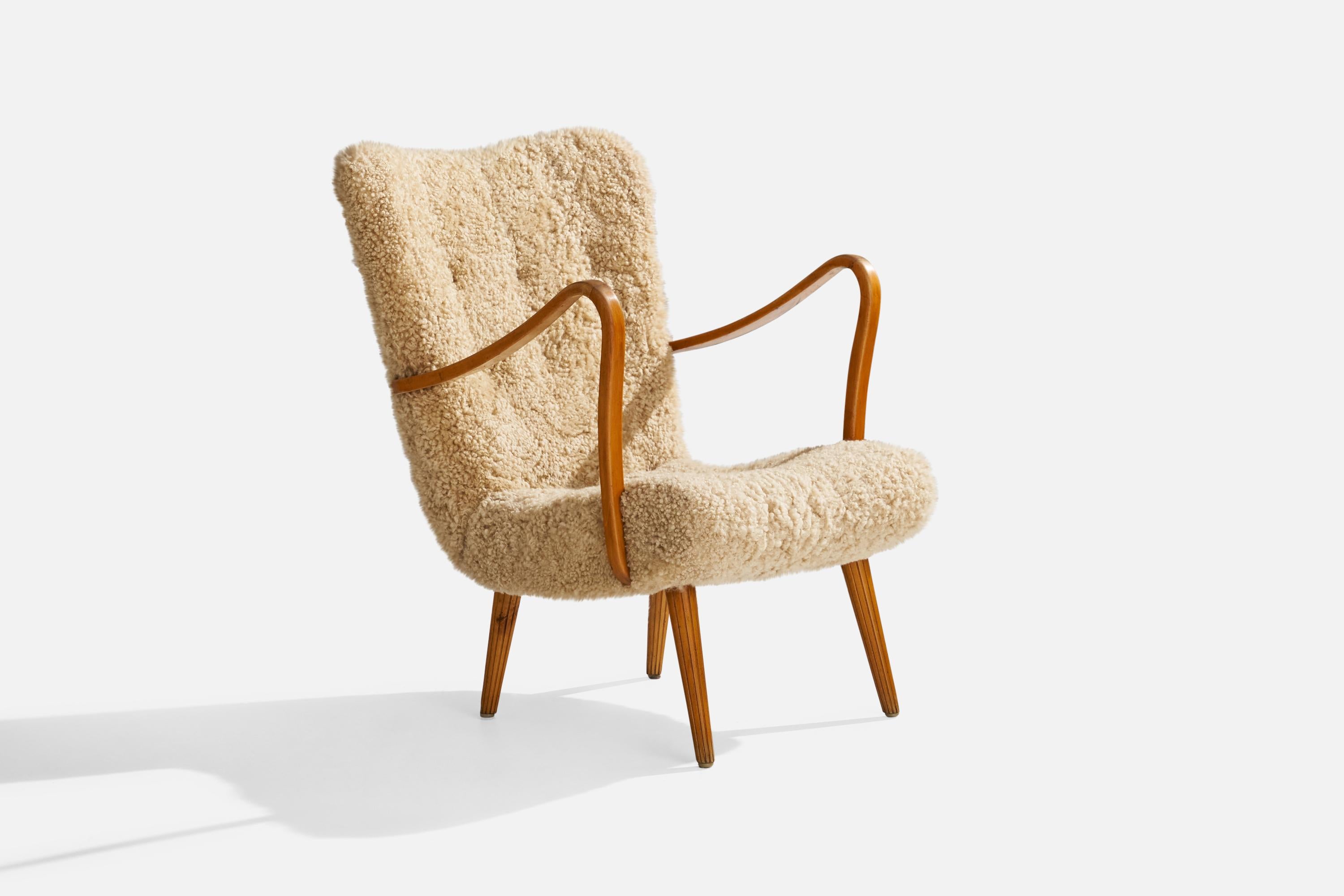 A wood and shearling lounge chair attributed to Carl Gustaf Hiort af Ornäs, Finland, 1950s.

For reference study model 