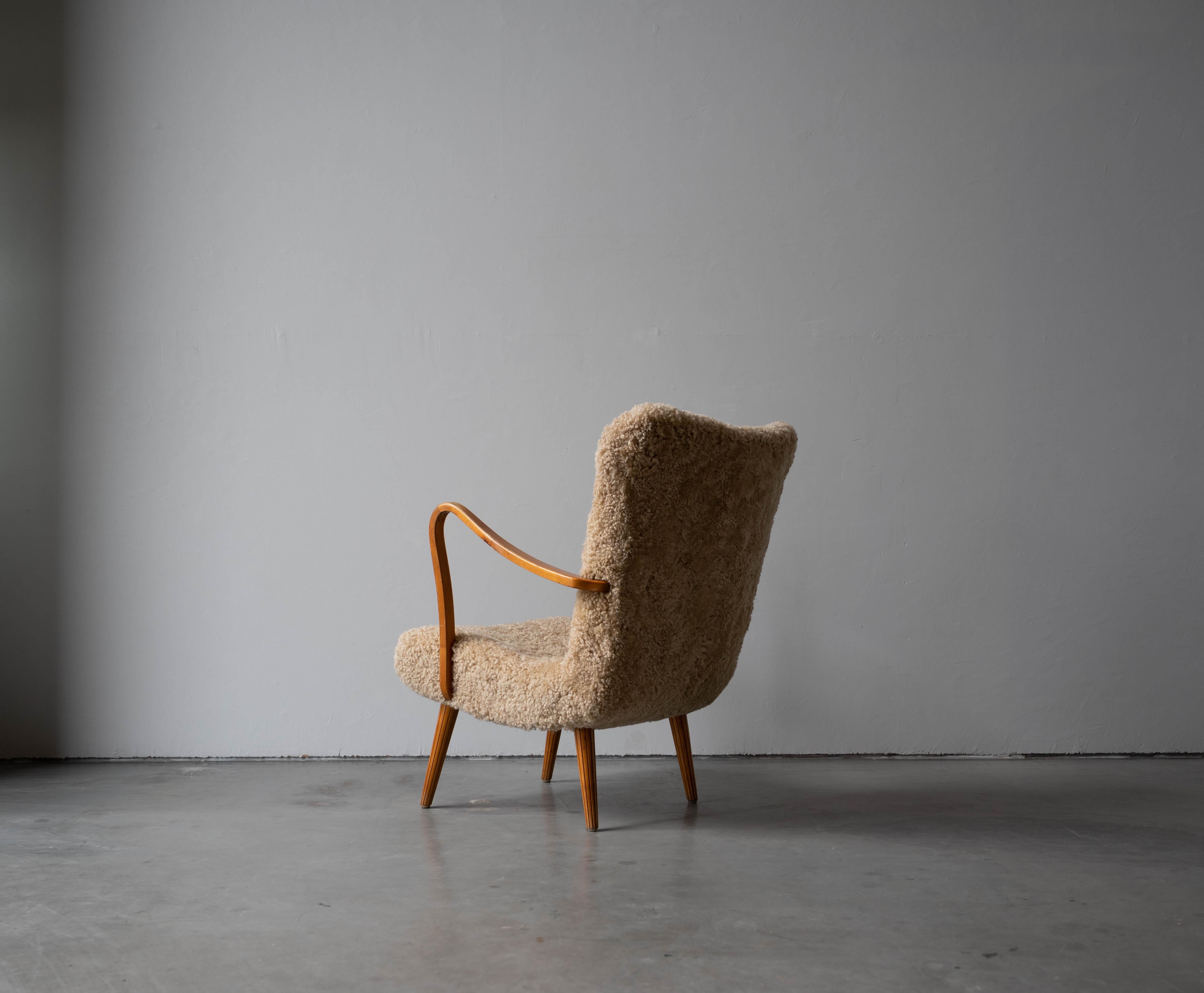 Swedish Carl Gustaf Hiort Af Ornäs, Lounge Chair, Wood, Sheepskin, Sweden, 1950s