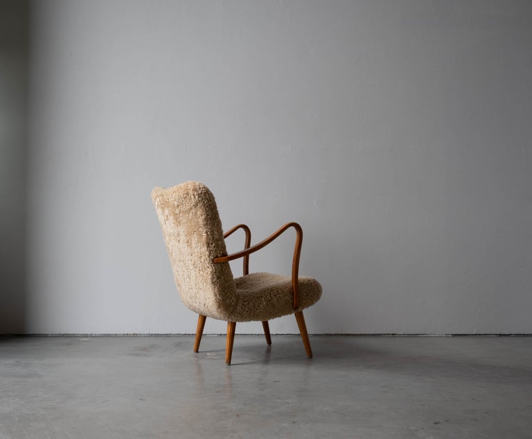 Mid-20th Century Carl Gustaf Hiort Af Ornäs, Lounge Chair, Wood, Sheepskin, Sweden, 1950s For Sale