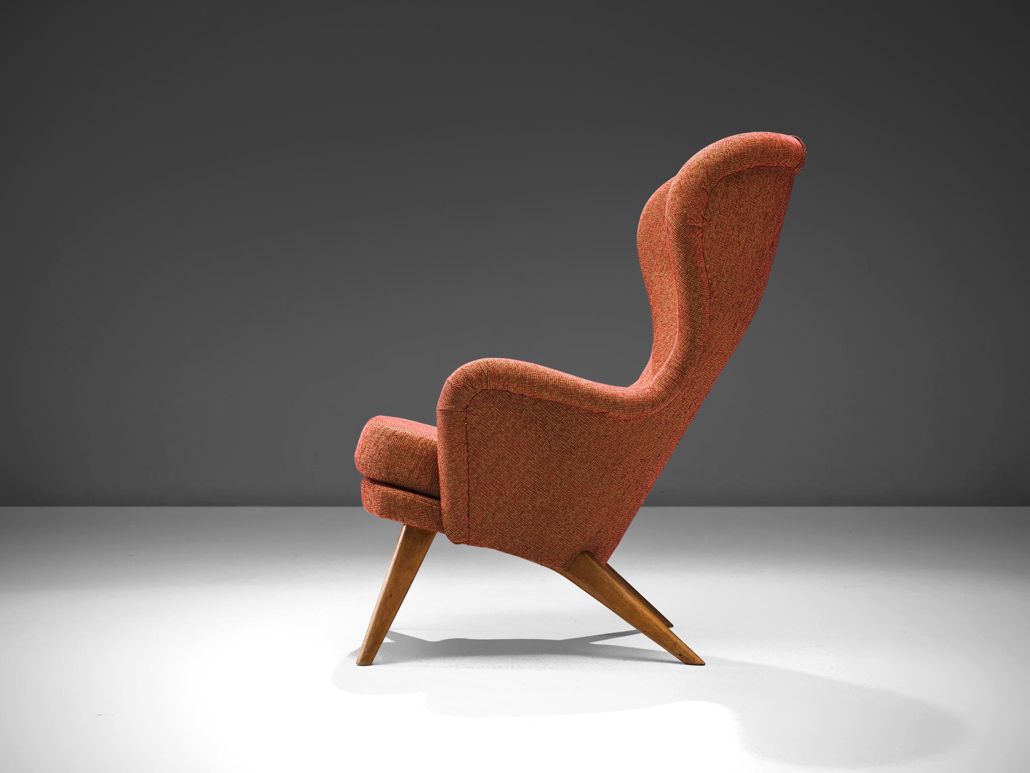Carl Gustaf Hiort for Puunveisto Oy - Träsnideri Ab, 'Siesta' lounge chair, fabric, oak, Finland, design 1952, production later.

This sensuous armchair has a curved, slender seat with a slightly winged back. The chair leans slightly backwards and