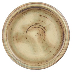Carl Halier for Royal Copenhagen. Low stoneware bowl with subtle glaze. 1965